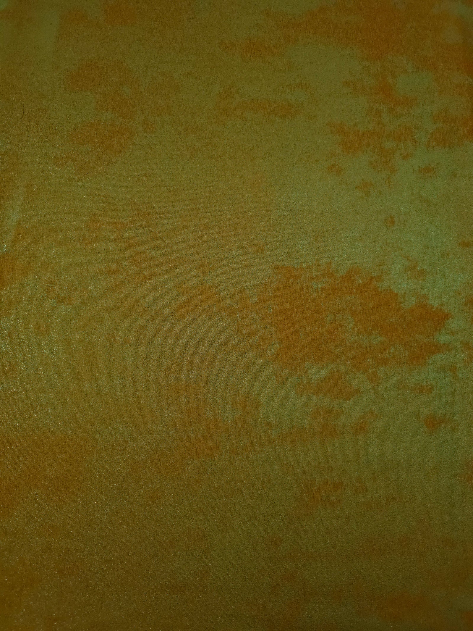 Flat view of Golden Olive Lurex Italiano fabric showing its metallic foil surface for luxury apparel.