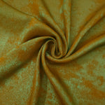 Rosette drape of Golden Olive Lurex Italiano fabric emphasizing shimmer for kaftans and occasionwear.