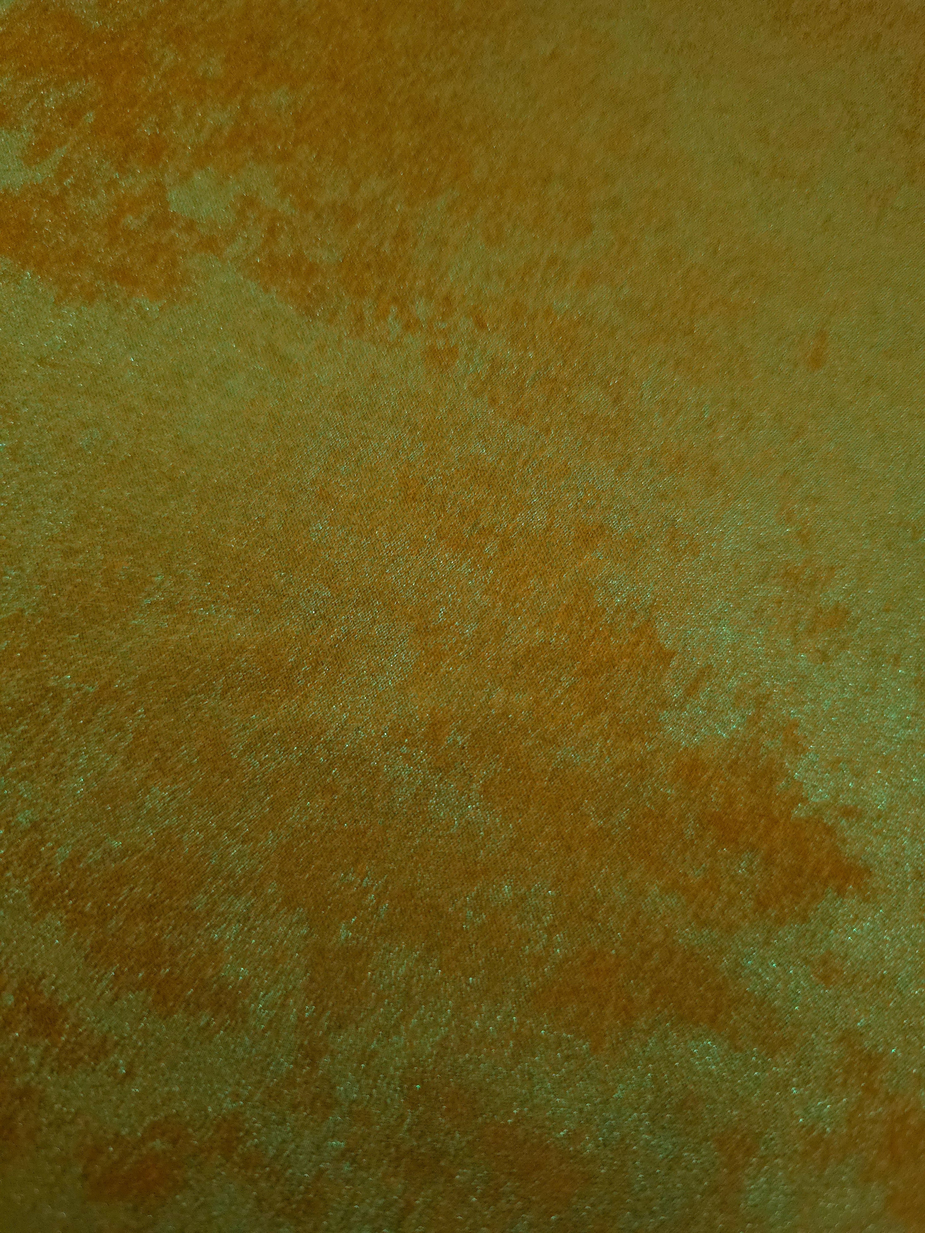 Macro close-up of Golden Olive Lurex Italiano fabric revealing metallic texture for designer apparel.