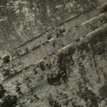 Graphite Silver Lurex Italiano fabric in diagonal folds showing metallic sheen and drape for eveningwear.