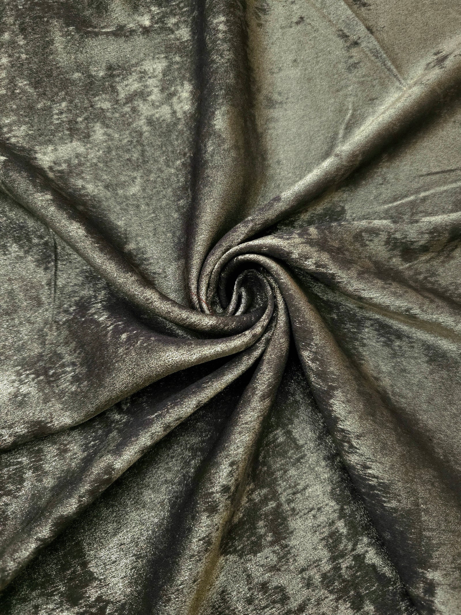 Flowing folds of Graphite Silver Lurex Italiano fabric highlighting drape for abayas, kaftans and dresses.