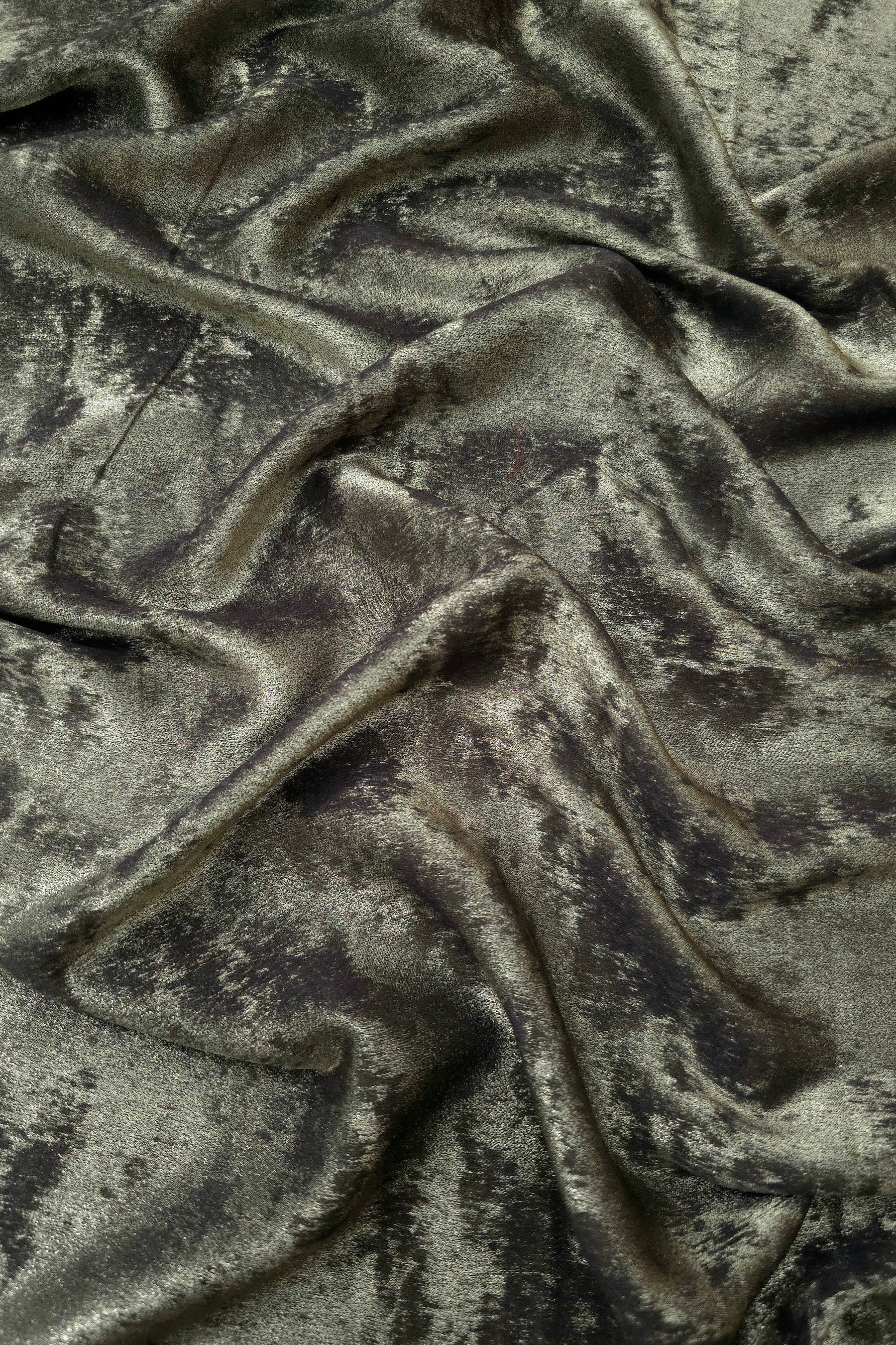 Rosette drape of Graphite Silver Lurex Italiano fabric emphasizing shimmer for kaftans and occasionwear.