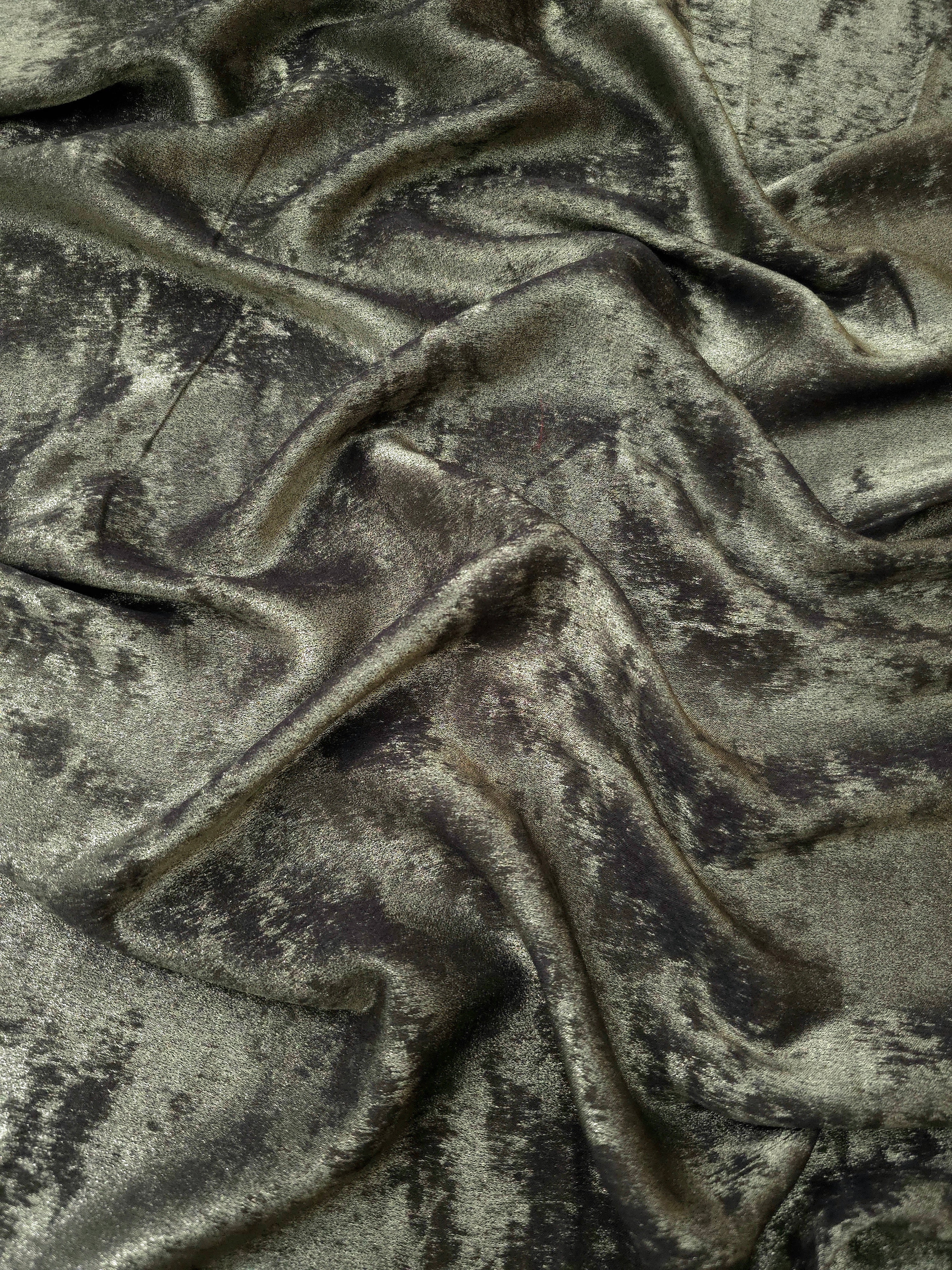 Rosette drape of Graphite Silver Lurex Italiano fabric emphasizing shimmer for kaftans and occasionwear.