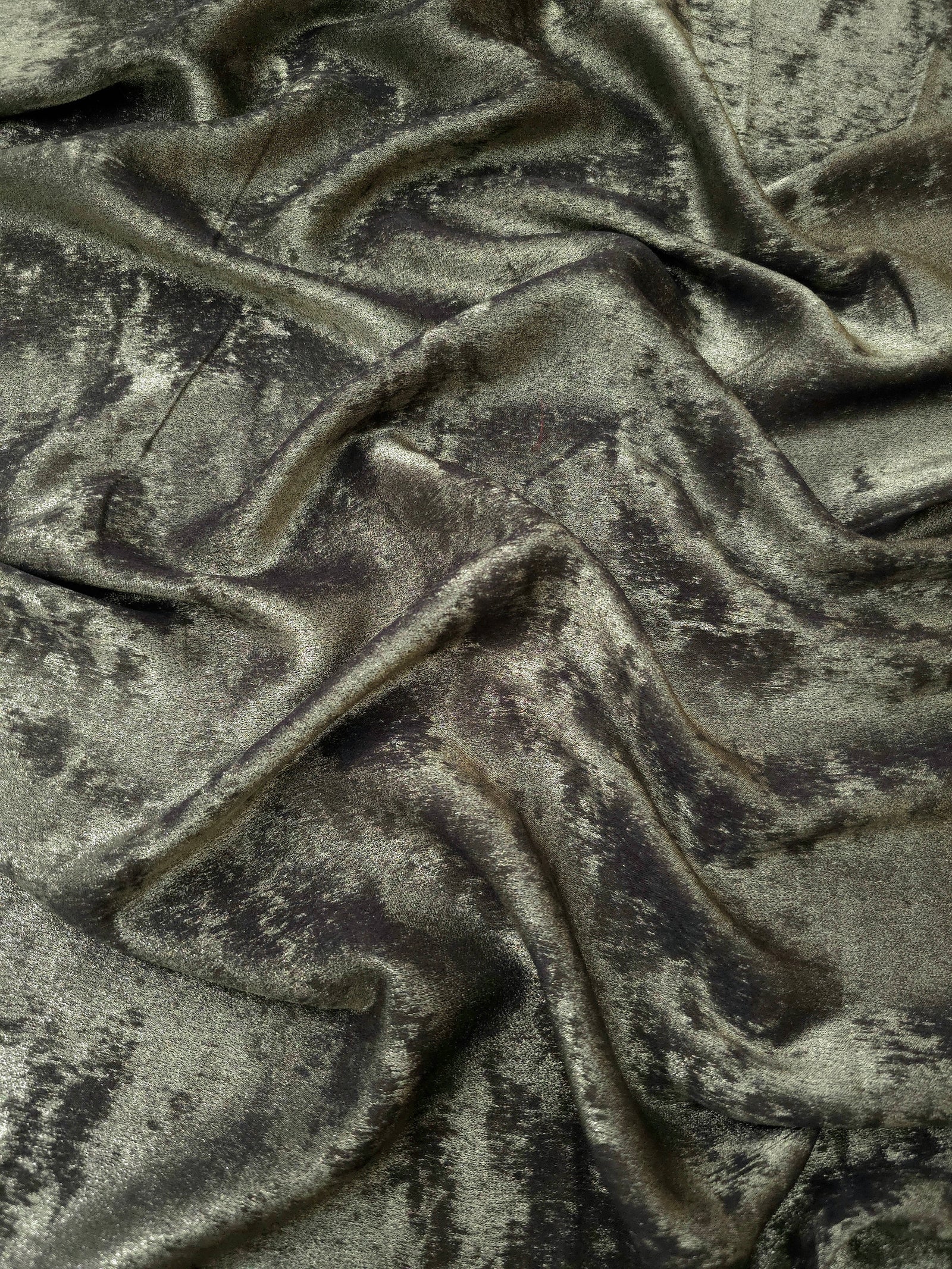 Rosette drape of Graphite Silver Lurex Italiano fabric emphasizing shimmer for kaftans and occasionwear.