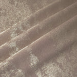 Rosette drape of Ivory Pearl Lurex Italiano fabric emphasizing shimmer for kaftans and occasionwear.