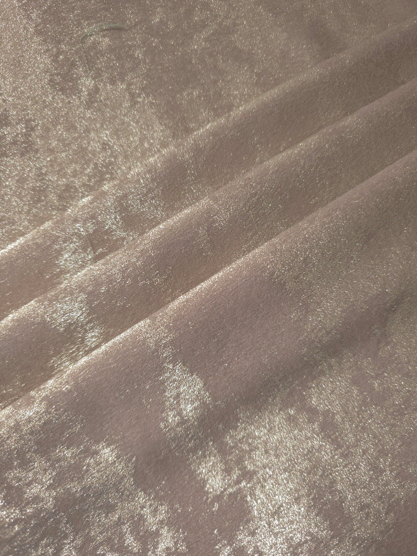 Rosette drape of Ivory Pearl Lurex Italiano fabric emphasizing shimmer for kaftans and occasionwear.