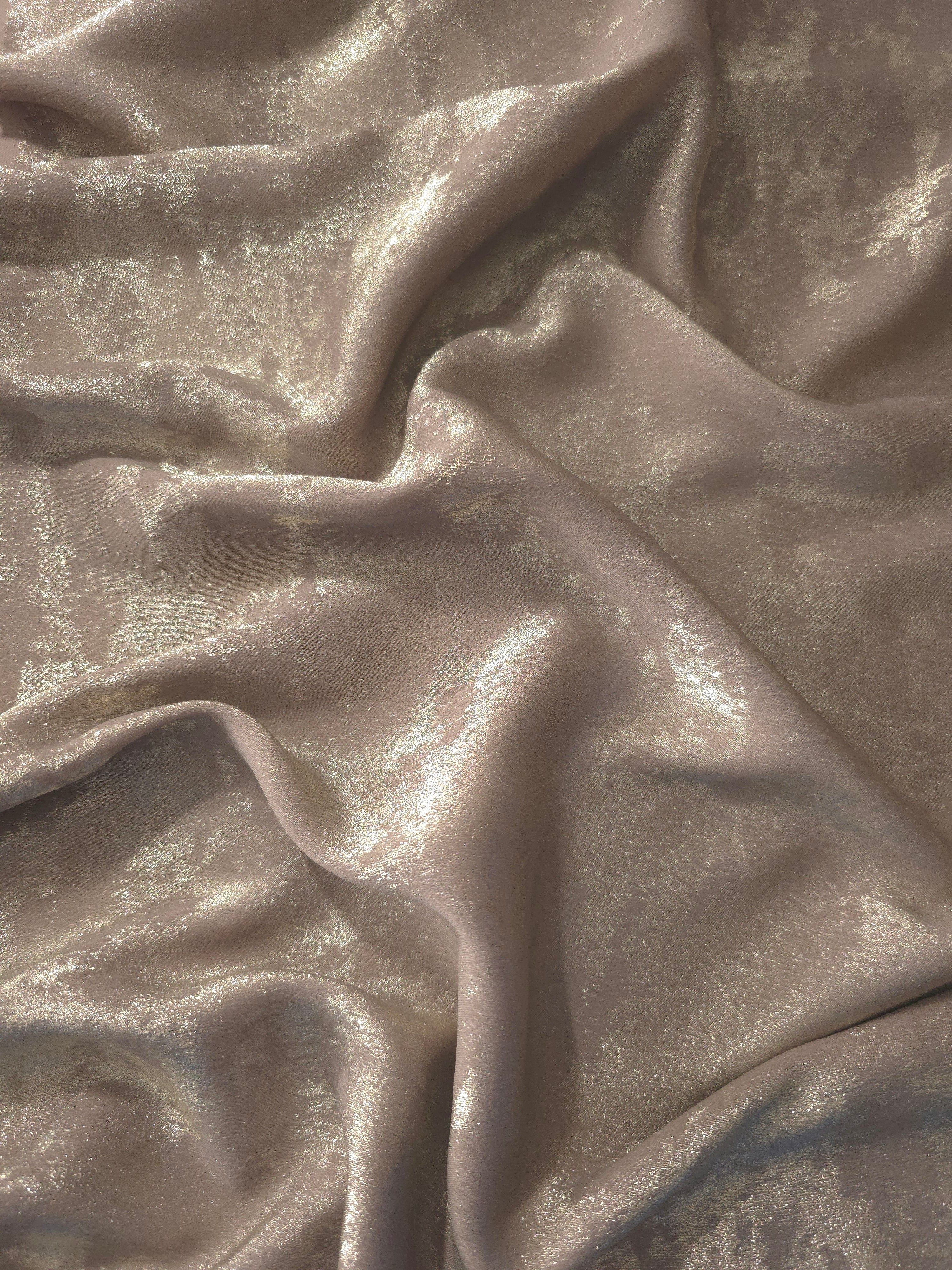Reverse side of Ivory Pearl Lurex Italiano fabric showing the backing and metallic finish for garment production.