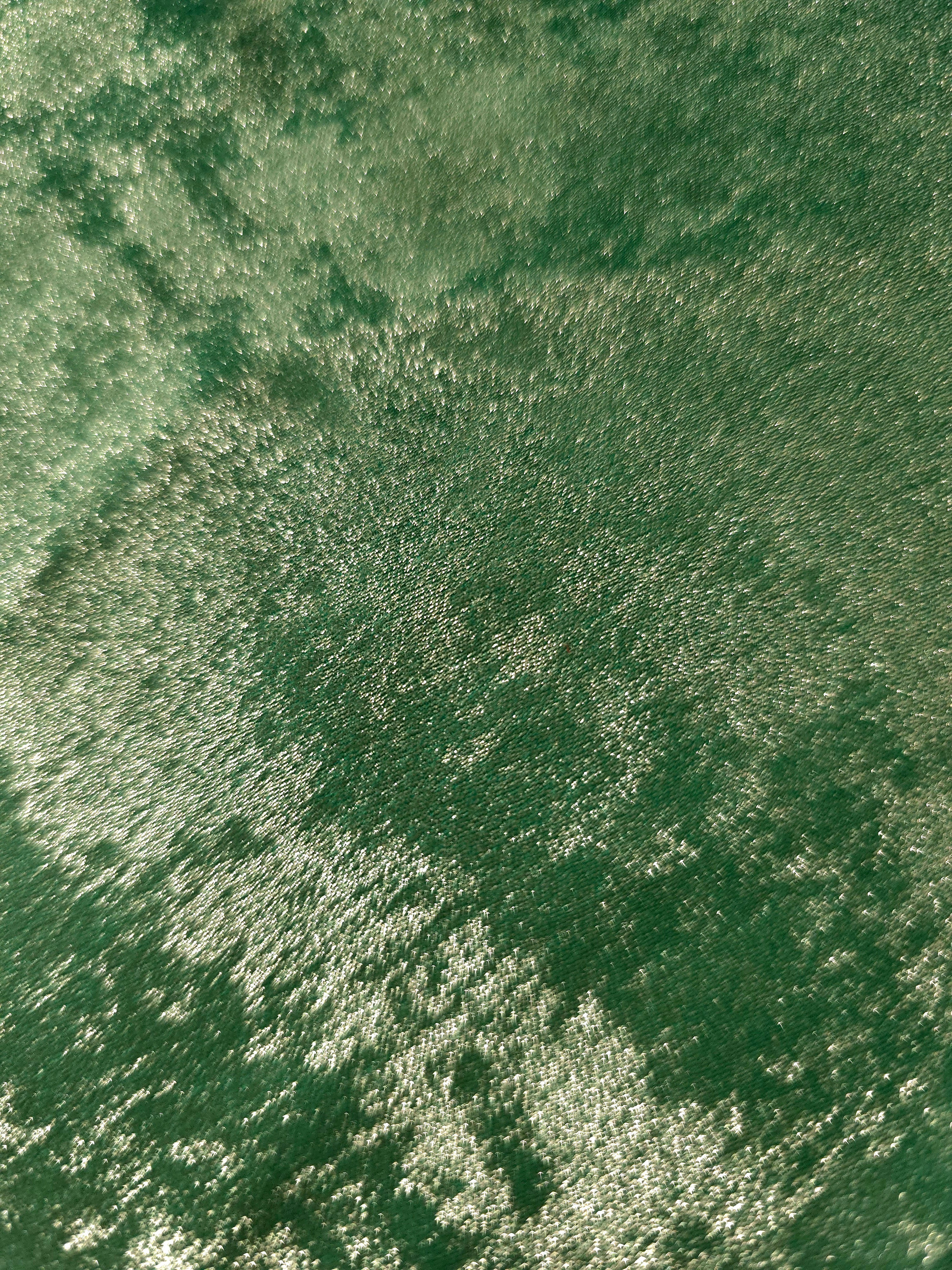 Macro close-up of Jade Green Lurex Italiano metallic fabric pearlescent texture