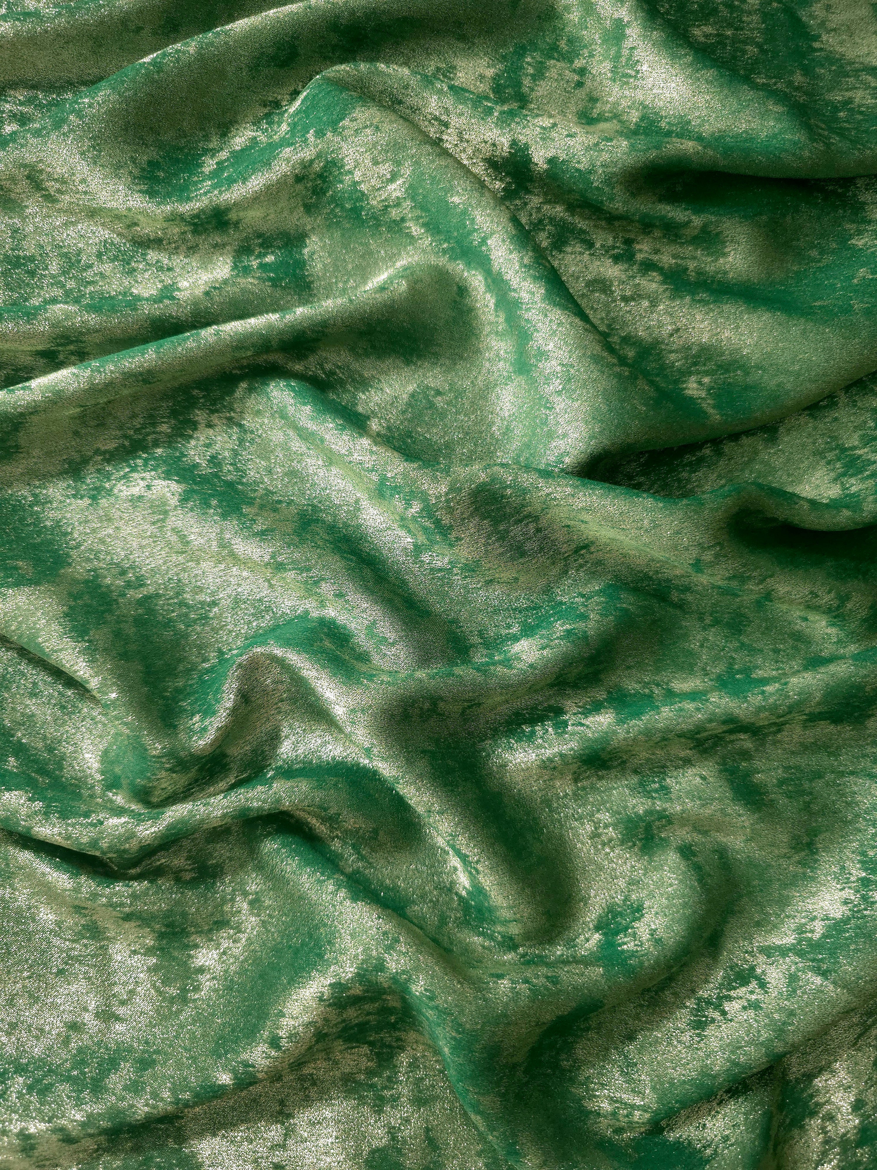 Reverse side of Jade Green Lurex Italiano metallic fabric for garment construction