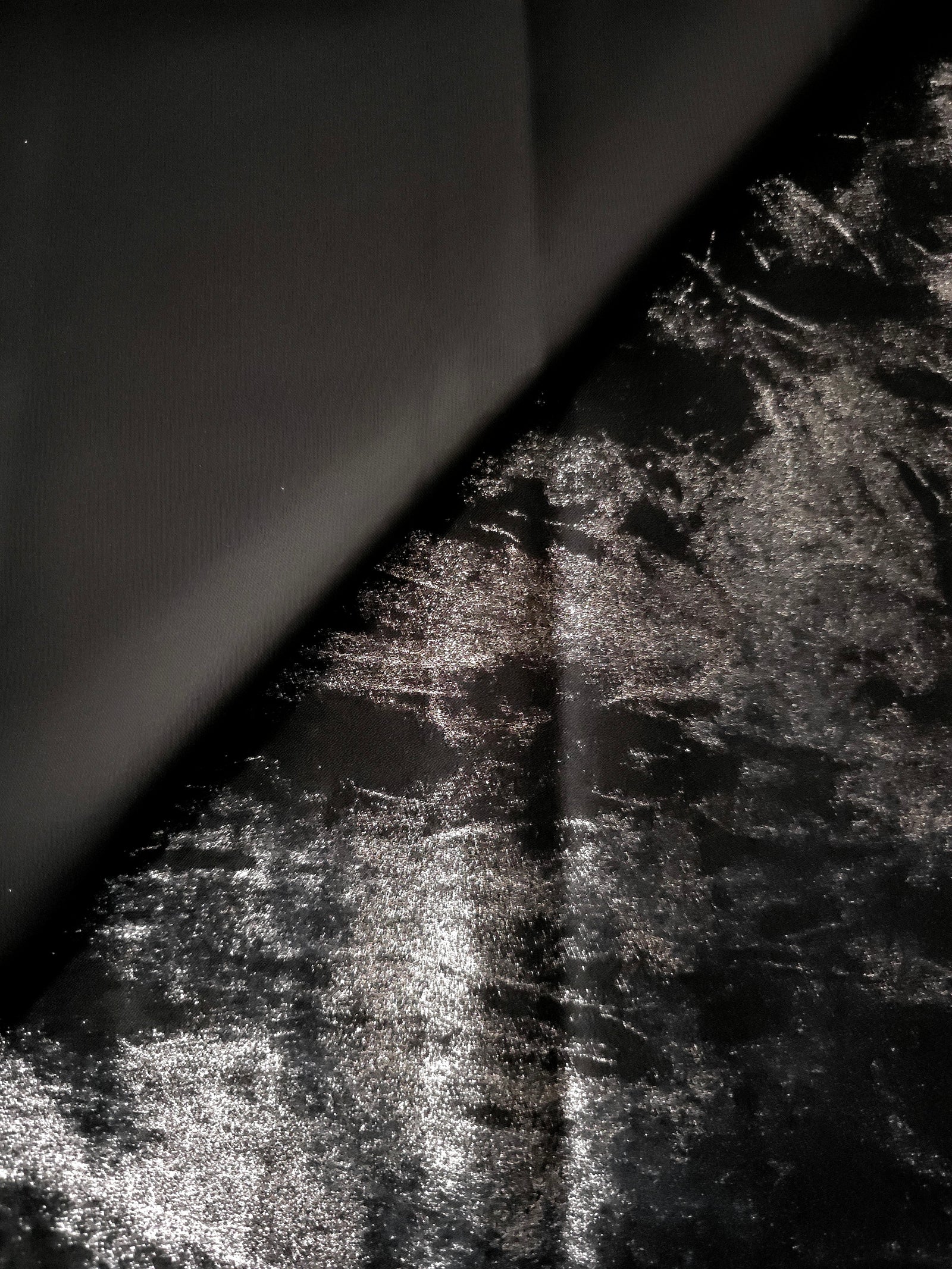 Flowing folds of Jet Black Lurex Italiano fabric highlighting drape for abayas, kaftans and dresses.