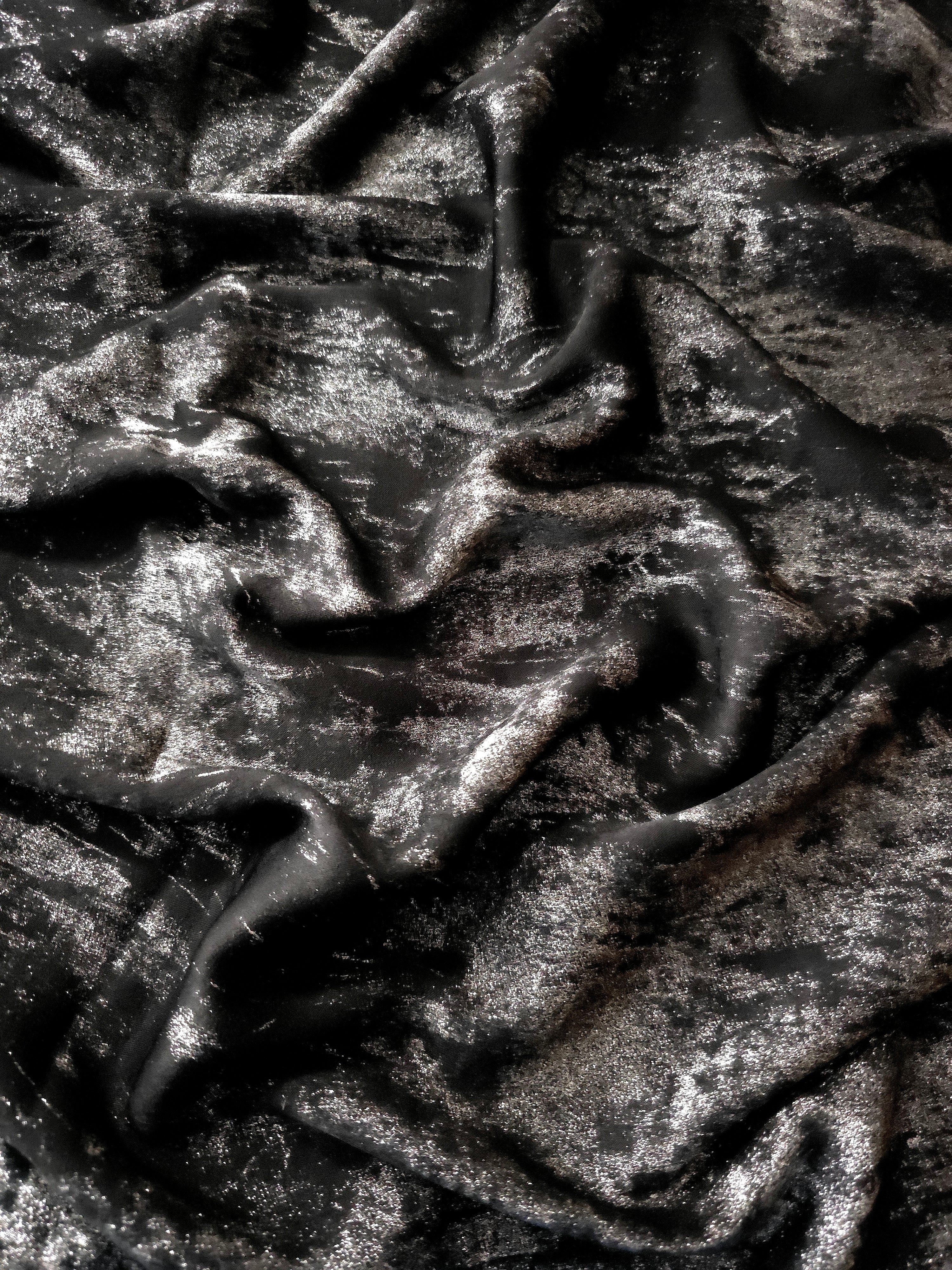 Reverse side of Jet Black Lurex Italiano fabric showing the backing and metallic finish for garment production.