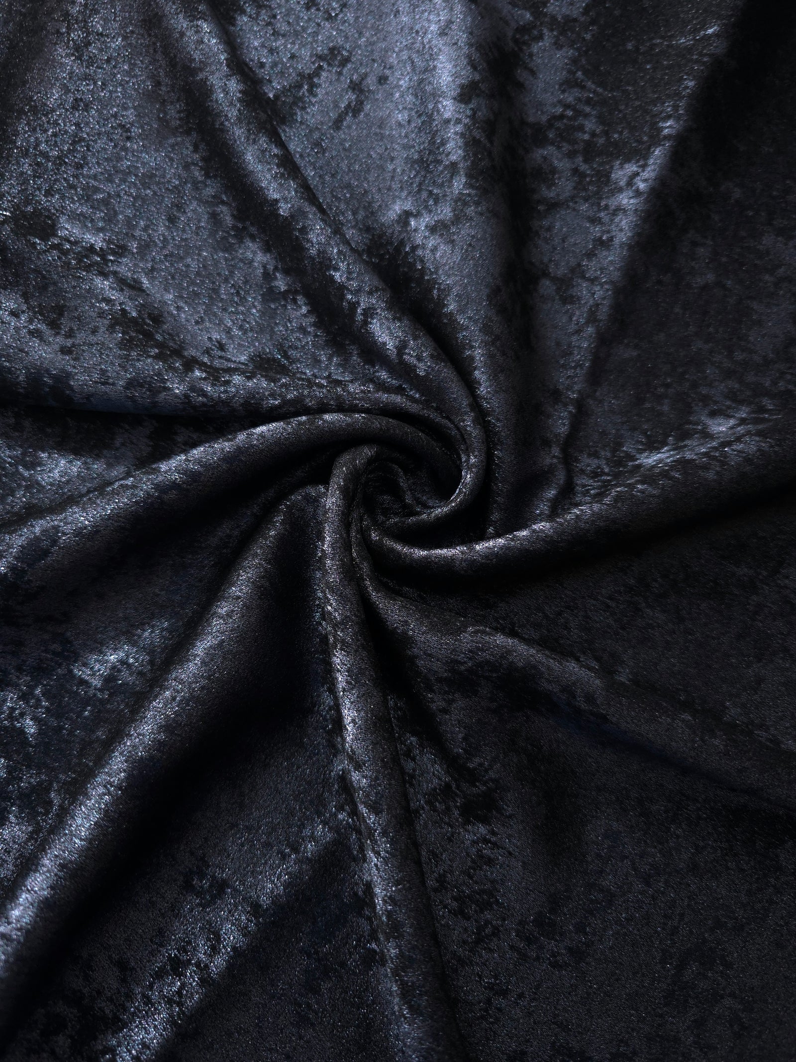 Rosette drape of Midnight Navy Lurex Italiano fabric emphasizing shimmer for kaftans and occasionwear.