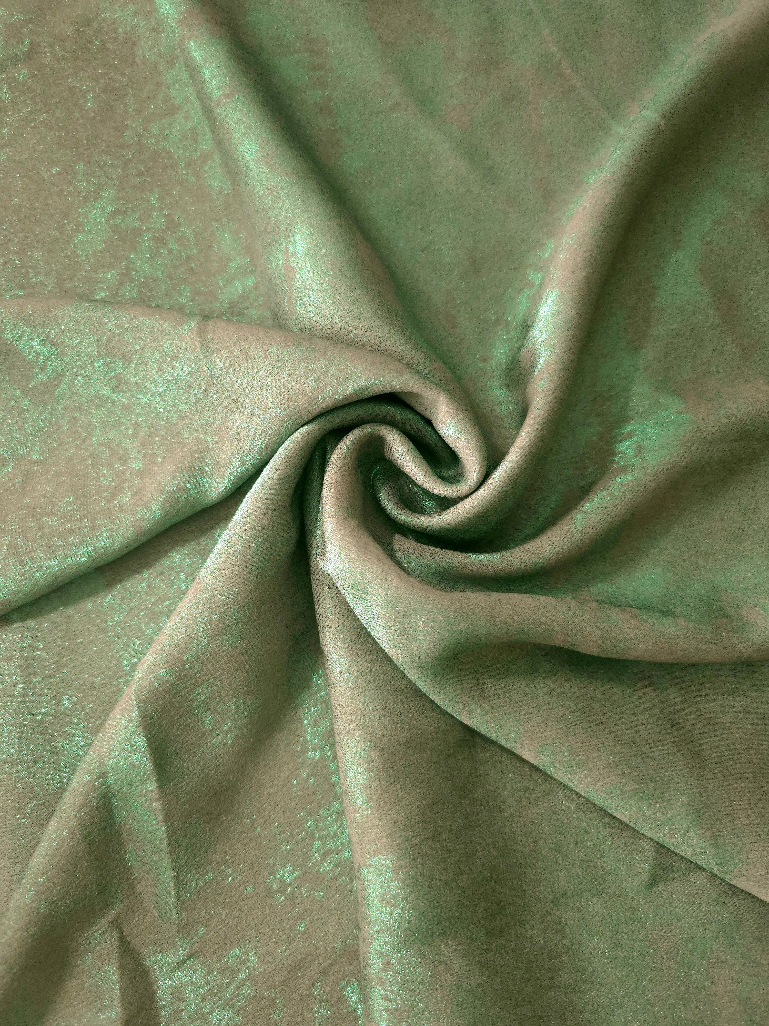 Rosette drape of Mint Sage Lurex Italiano fabric emphasizing shimmer for kaftans and occasionwear.