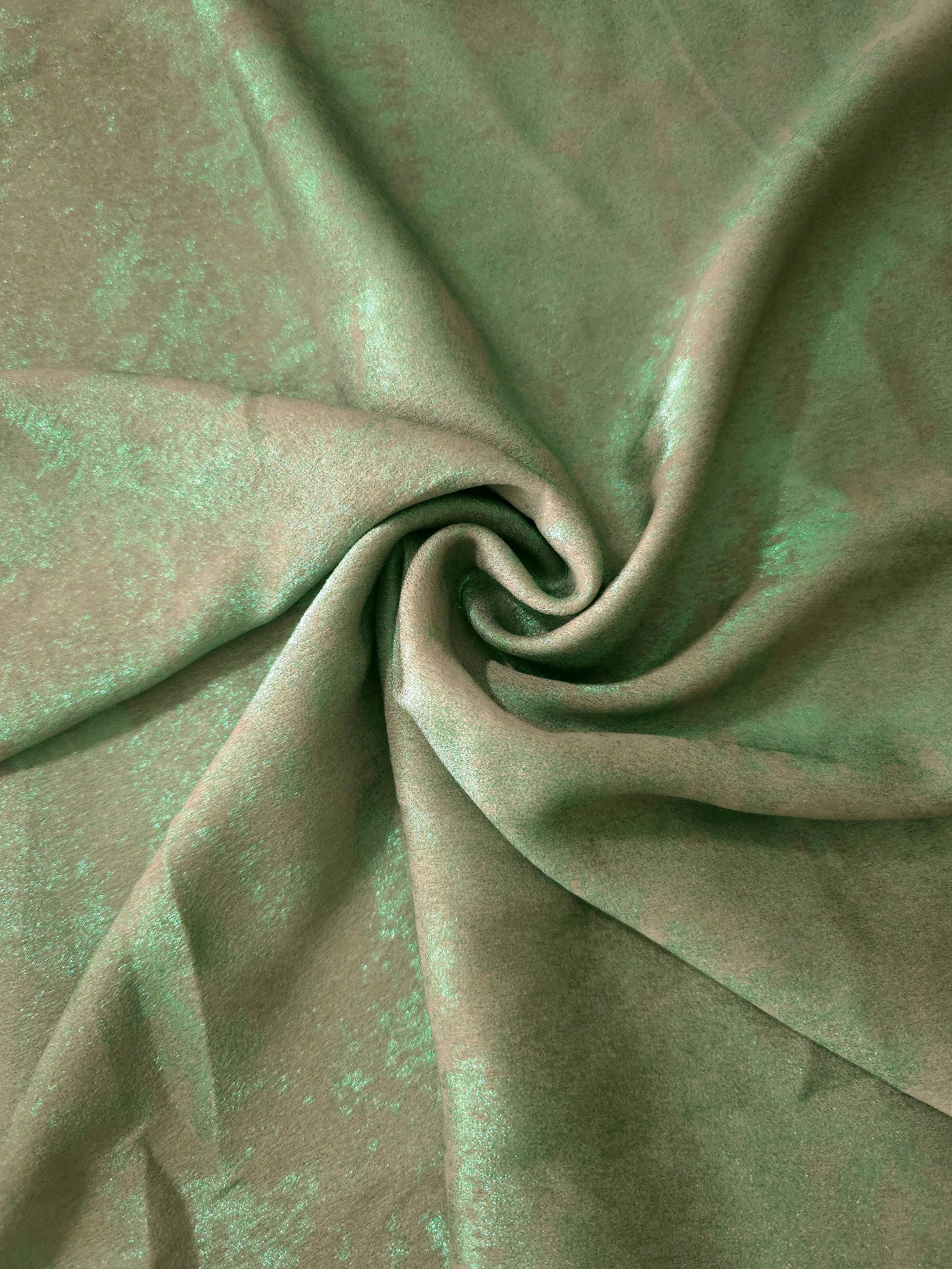 Rosette drape of Mint Sage Lurex Italiano fabric emphasizing shimmer for kaftans and occasionwear.