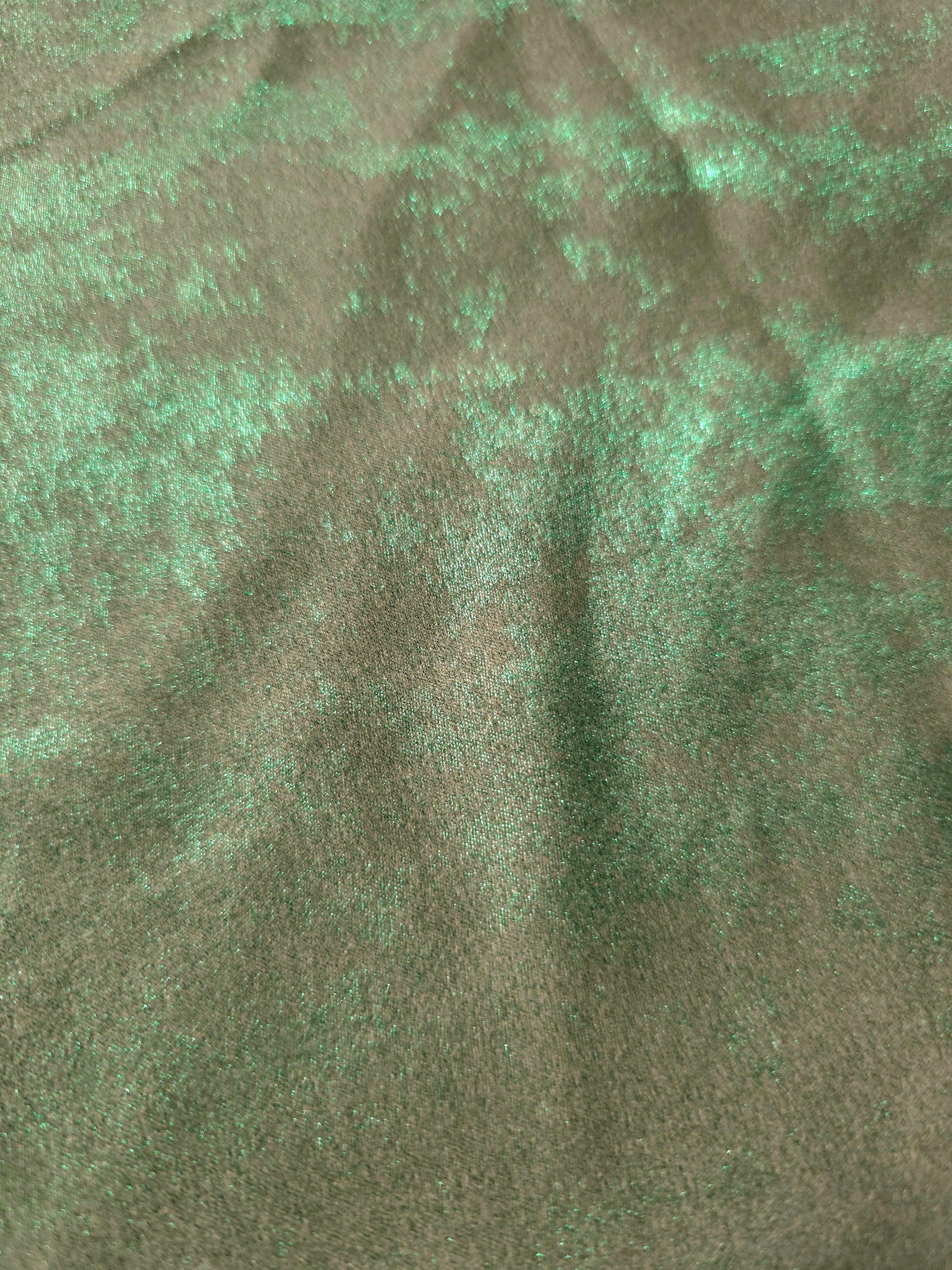 Macro close-up of Mint Sage Lurex Italiano fabric revealing metallic texture for designer apparel.