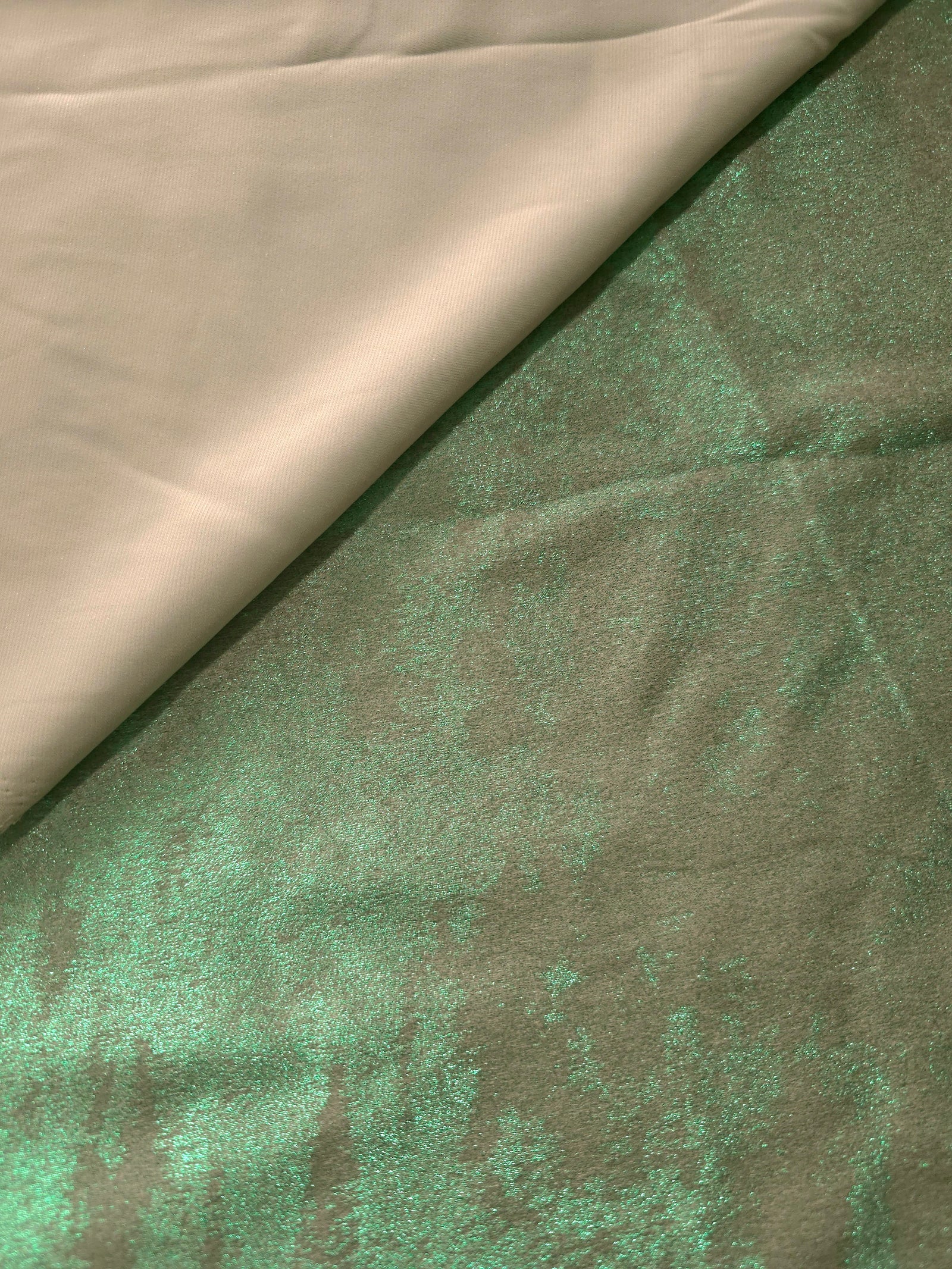 Reverse side of Mint Sage Lurex Italiano fabric showing the backing and metallic finish for garment production.
