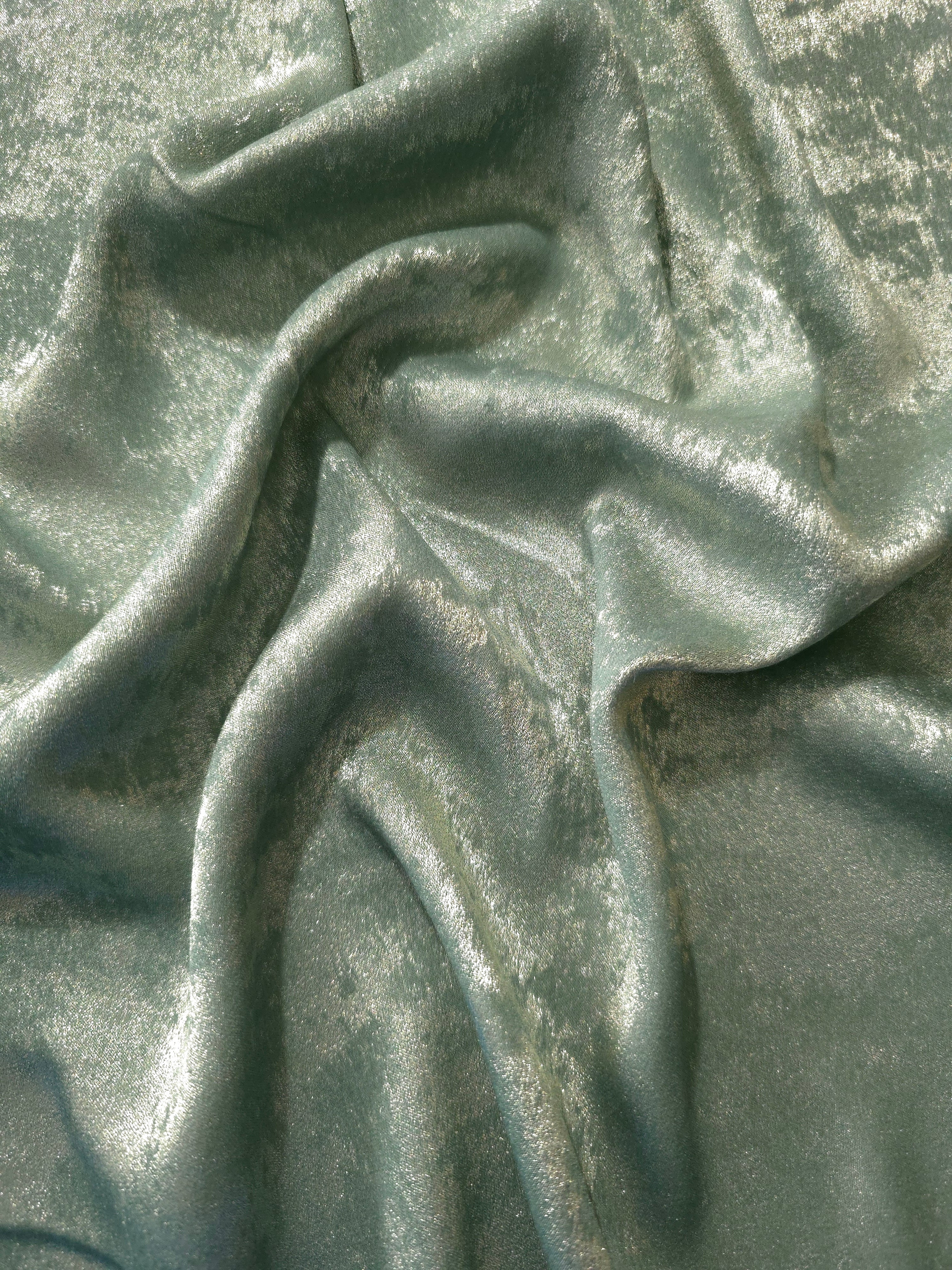 Reverse side of Misty Sage Lurex Italiano metallic fabric for garment construction