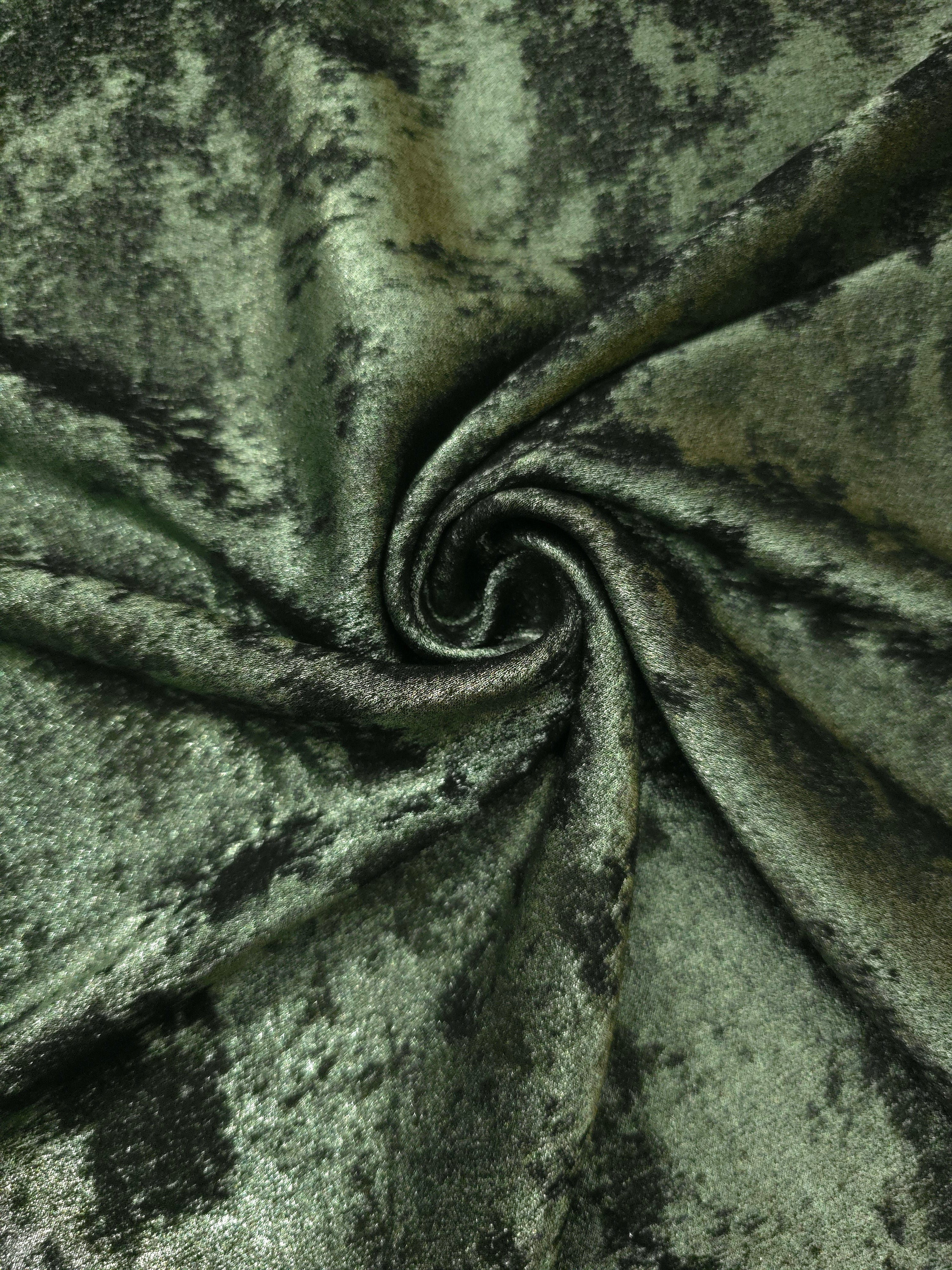Moss Green Lurex Italiano metallic fabric in a rosette drape with earthy shimmer