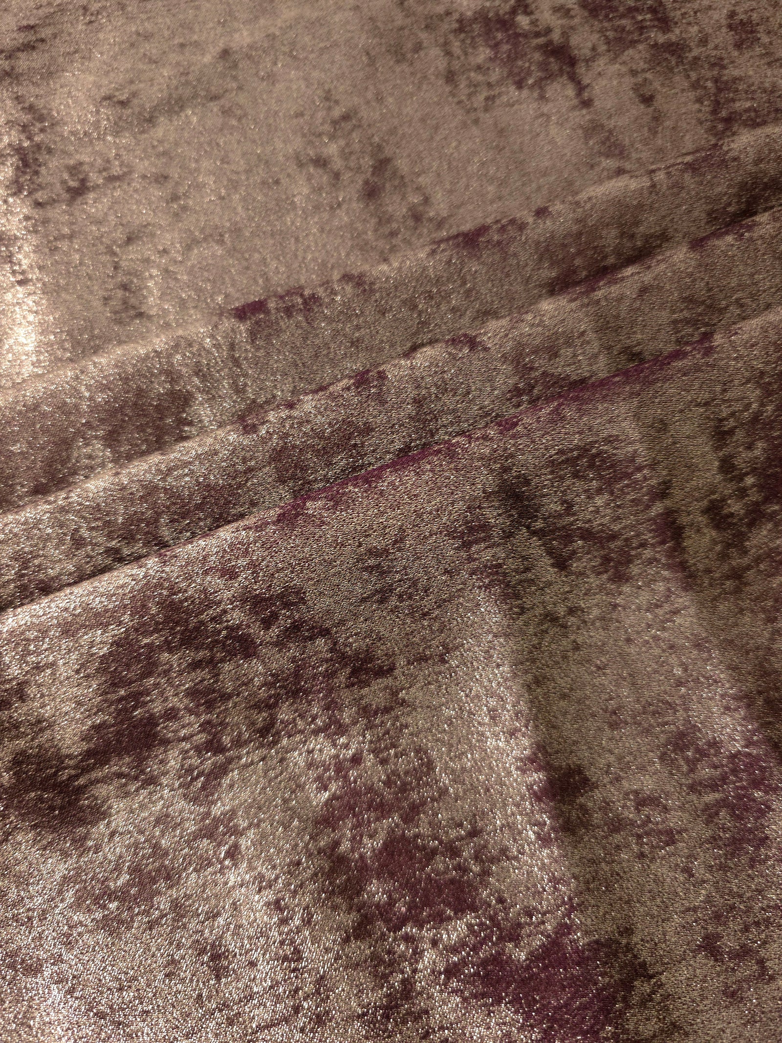 Mushroom Taupe Lurex Italiano fabric in diagonal folds showing metallic sheen and drape for eveningwear.
