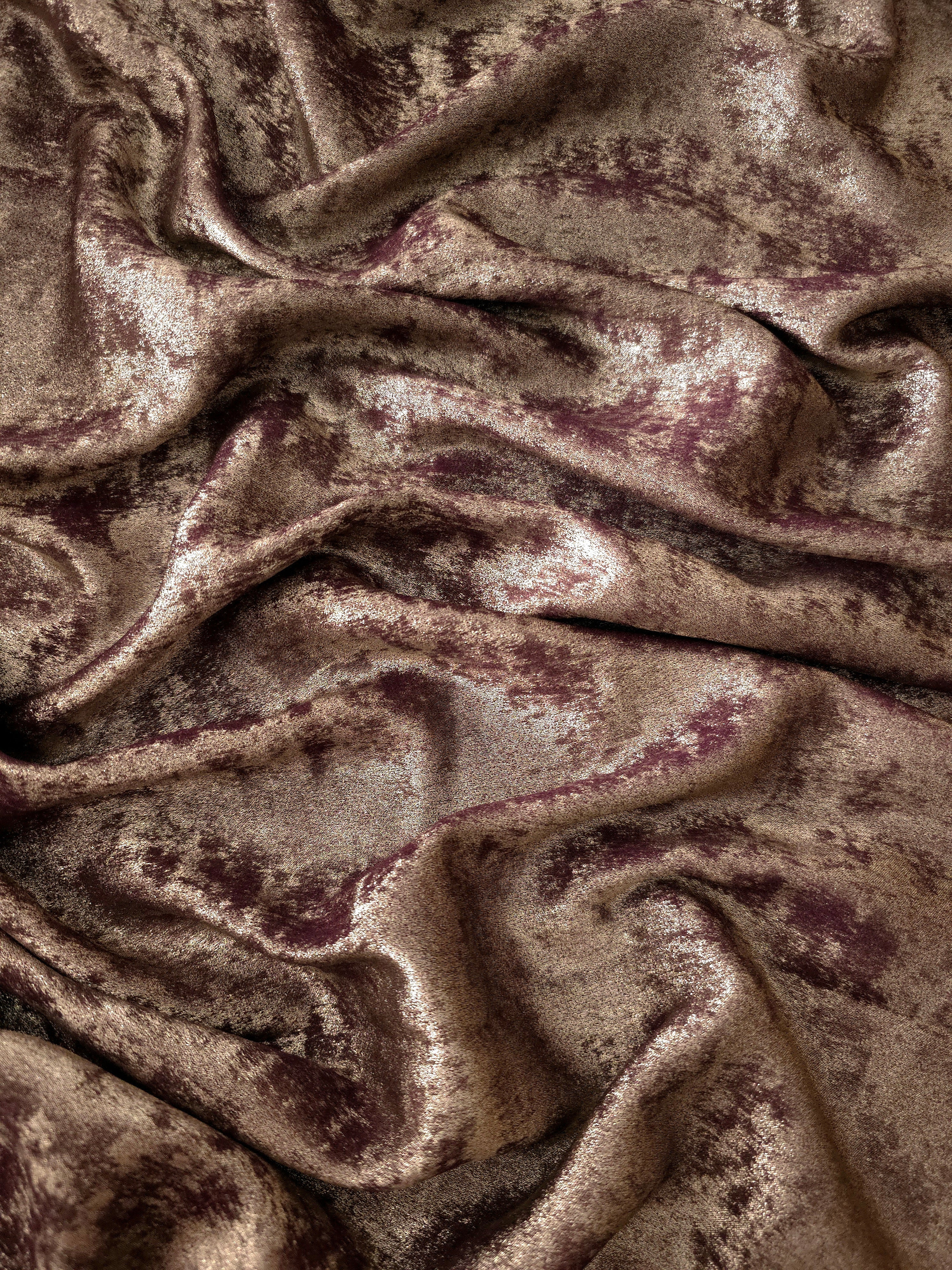 Flowing folds of Mushroom Taupe Lurex Italiano fabric highlighting drape for abayas, kaftans and dresses.