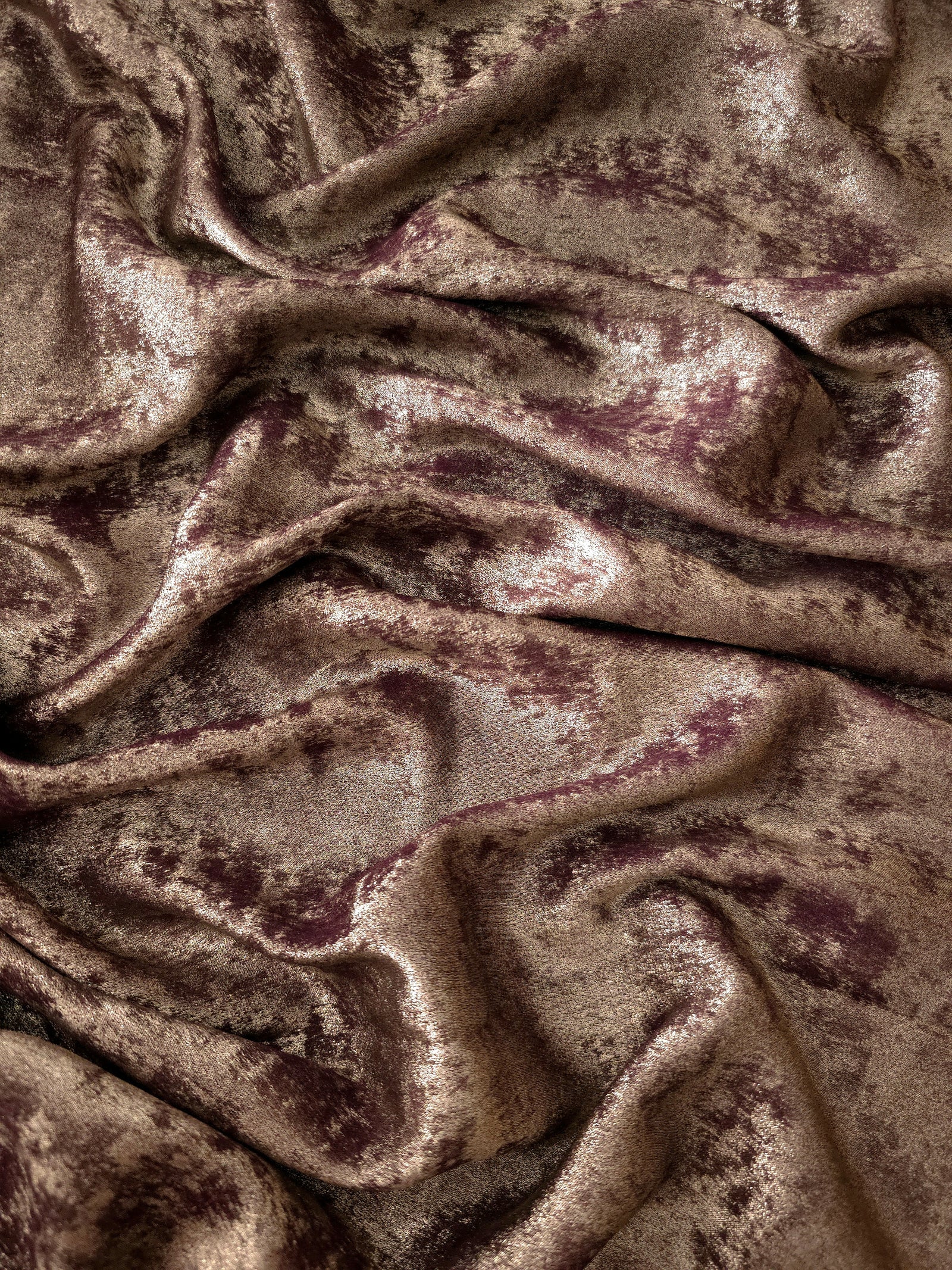 Flowing folds of Mushroom Taupe Lurex Italiano fabric highlighting drape for abayas, kaftans and dresses.