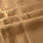 Flowing folds of Nude Gold Lurex Italiano fabric highlighting drape for abayas, kaftans and dresses.
