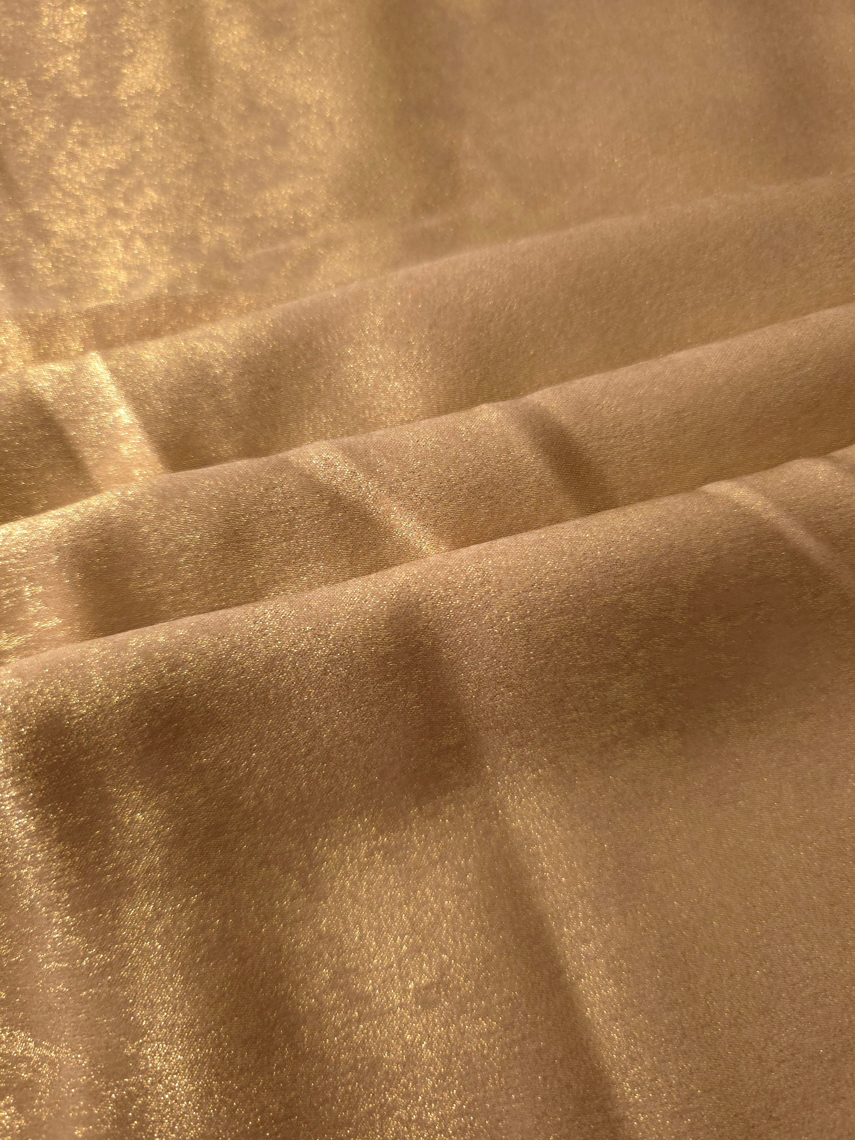 Flowing folds of Nude Gold Lurex Italiano fabric highlighting drape for abayas, kaftans and dresses.