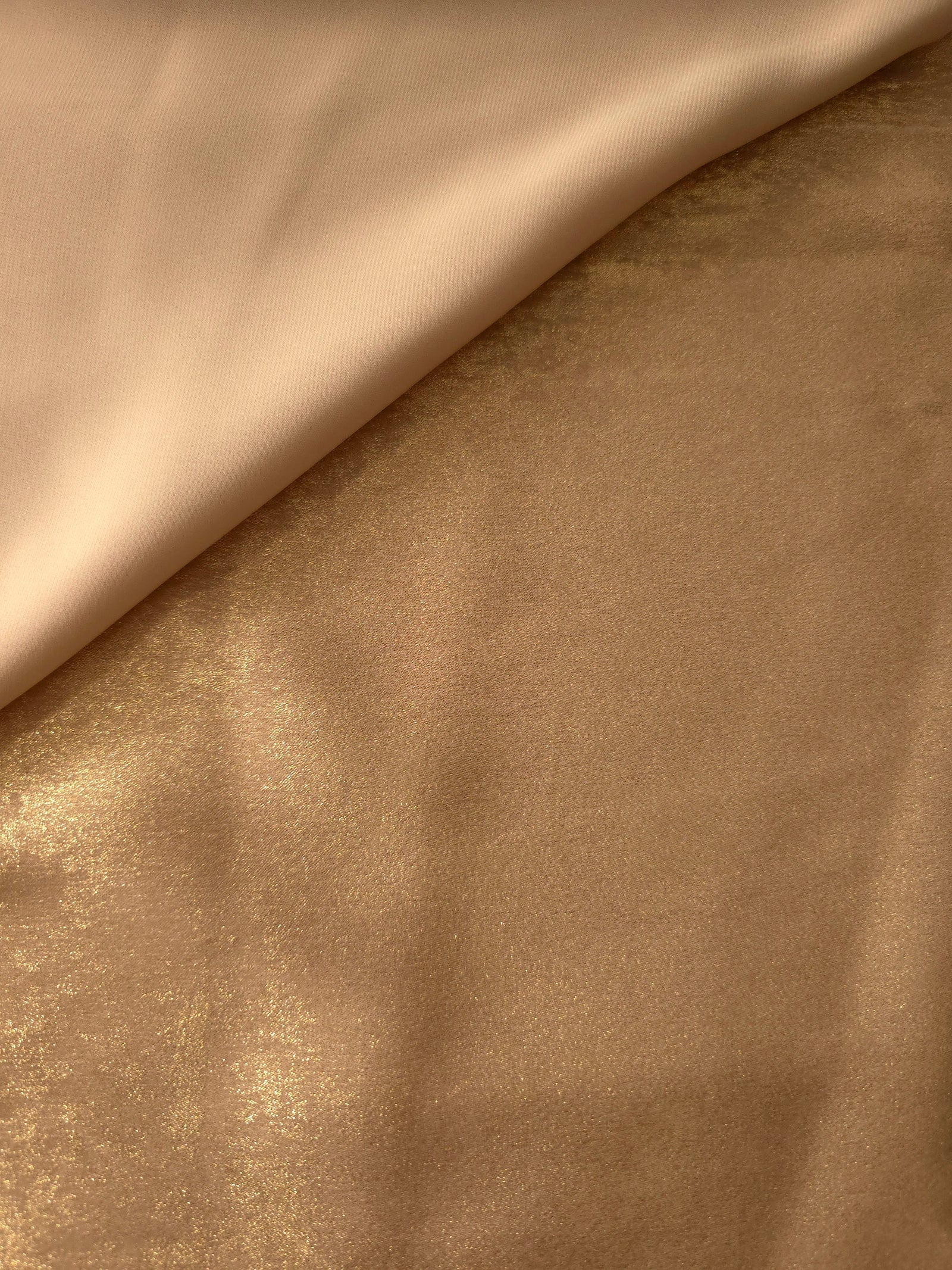 Flat view of Nude Gold Lurex Italiano fabric showing its metallic foil surface for luxury apparel.