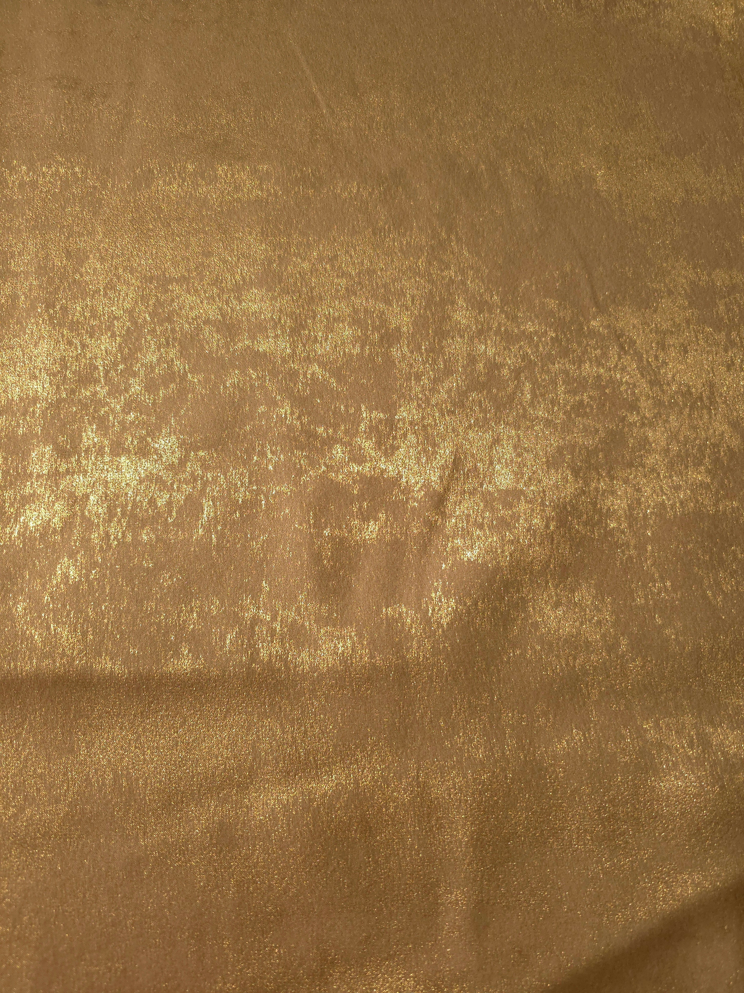 Rosette drape of Nude Gold Lurex Italiano fabric emphasizing shimmer for kaftans and occasionwear.