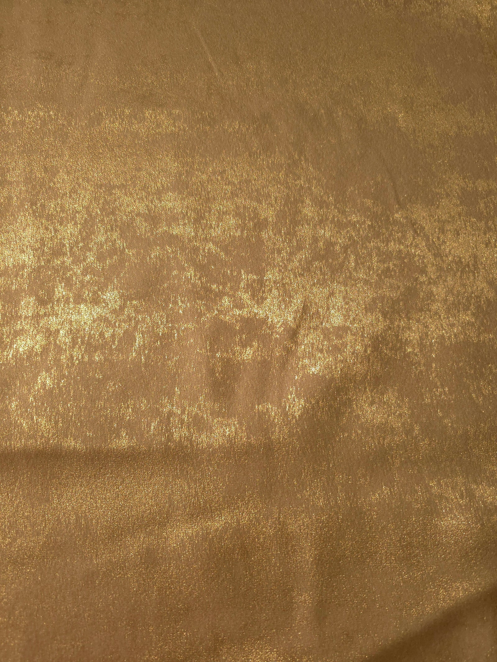 Rosette drape of Nude Gold Lurex Italiano fabric emphasizing shimmer for kaftans and occasionwear.