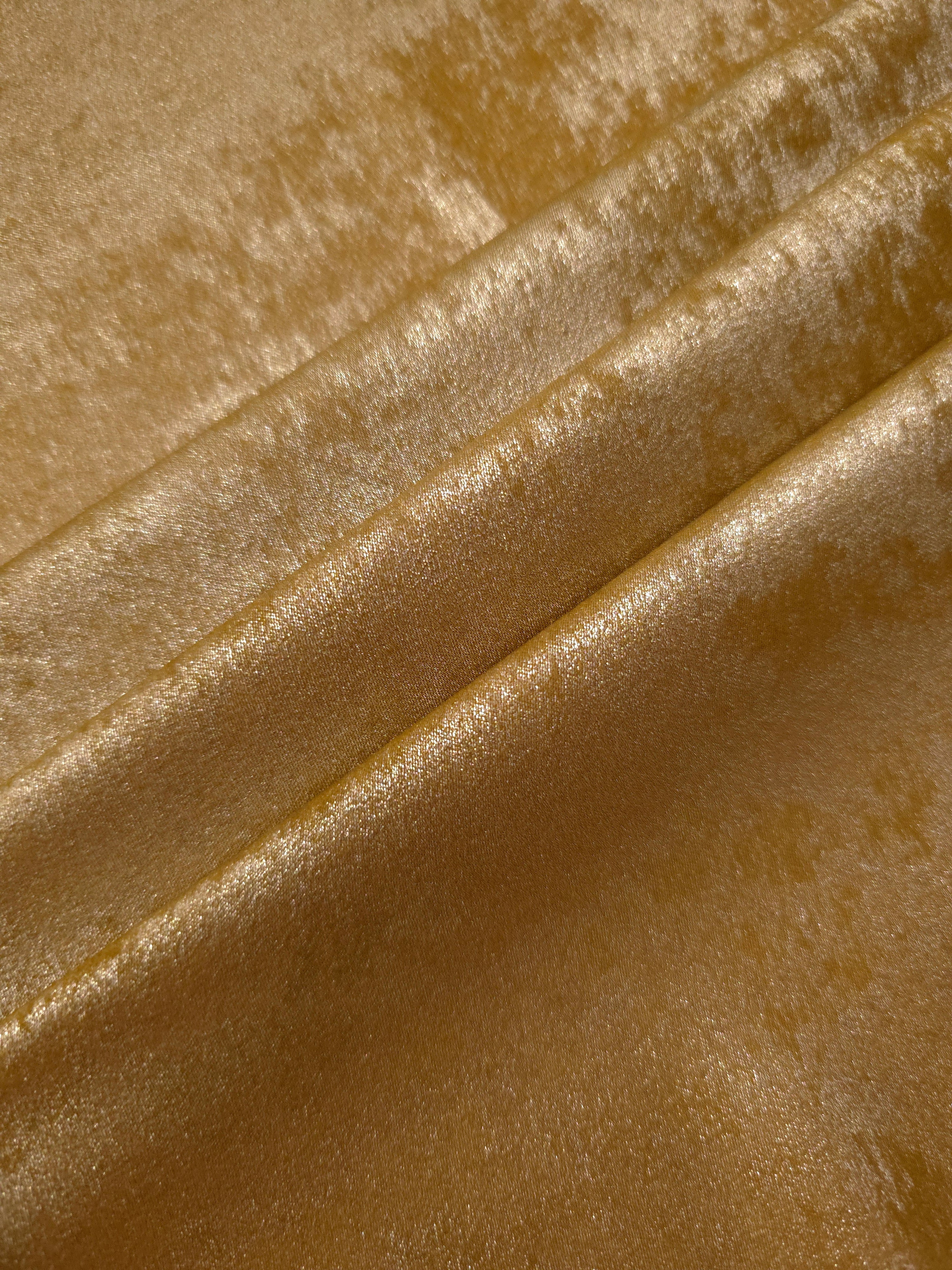 Ochre Gold Lurex Italiano metallic fabric arranged in diagonal eveningwear folds