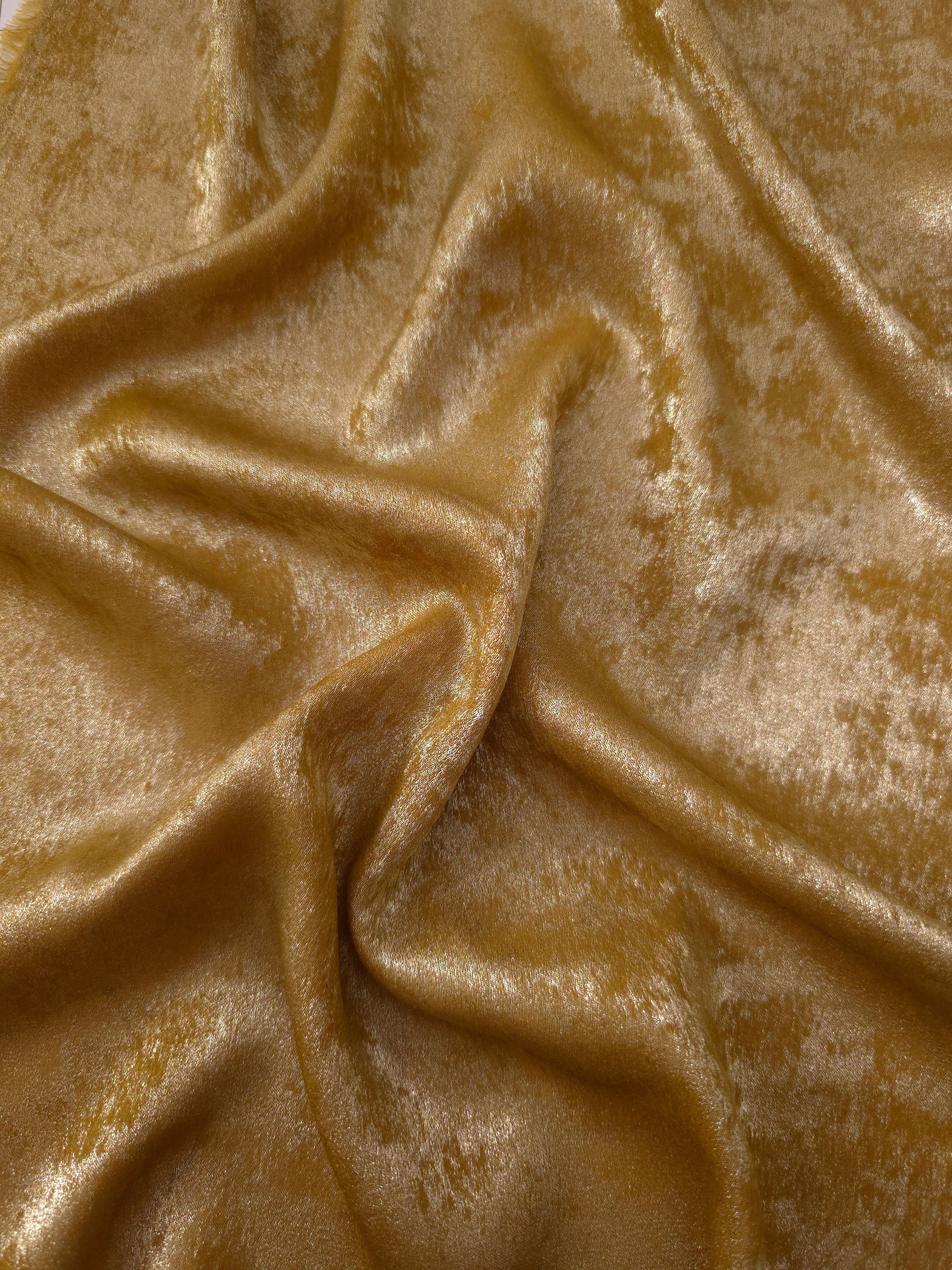Fluid drape of Ochre Gold Lurex Italiano metallic fabric for abayas and gowns
