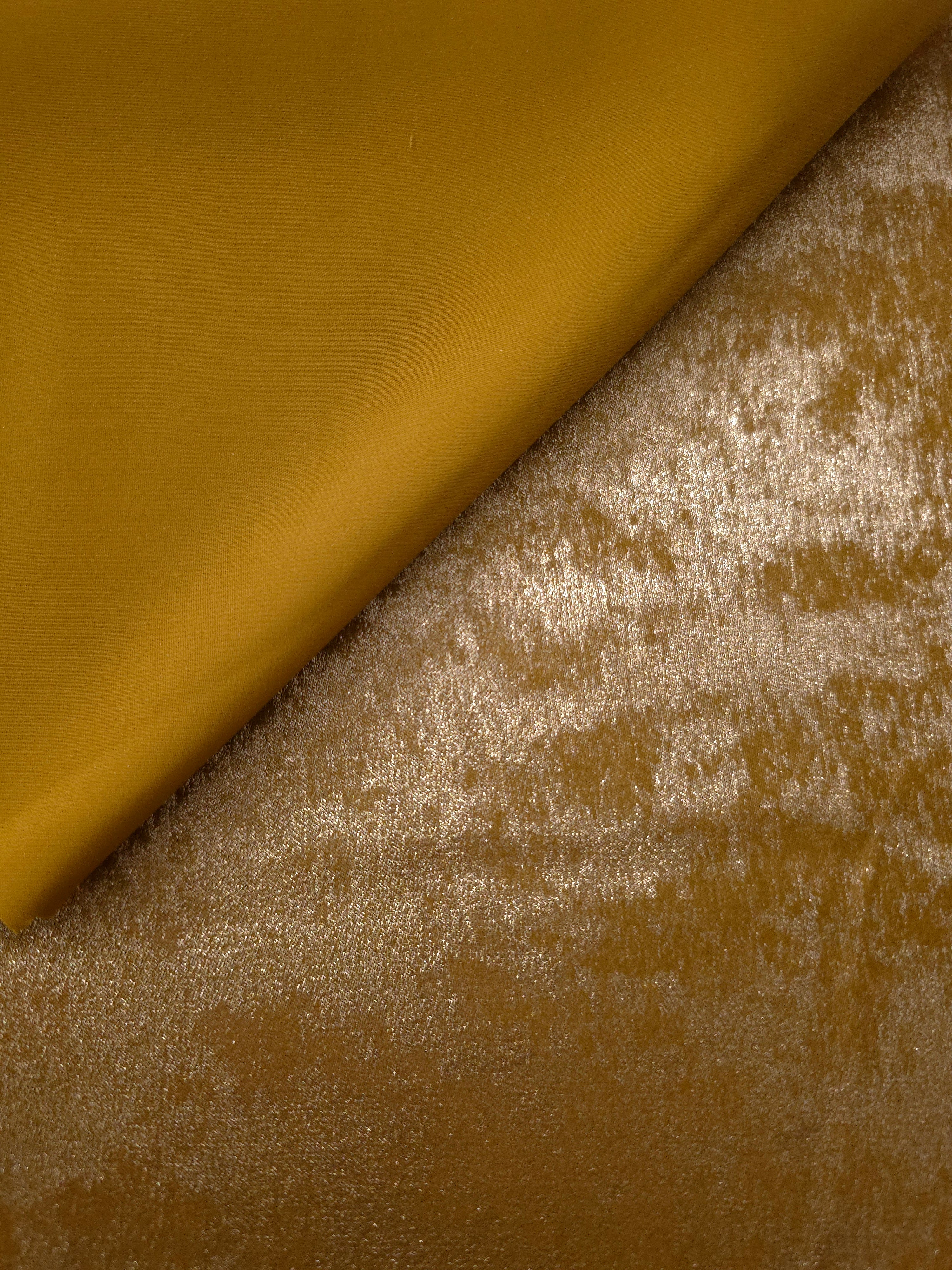 Reverse side of Ochre Gold Lurex Italiano metallic fabric for apparel sewing