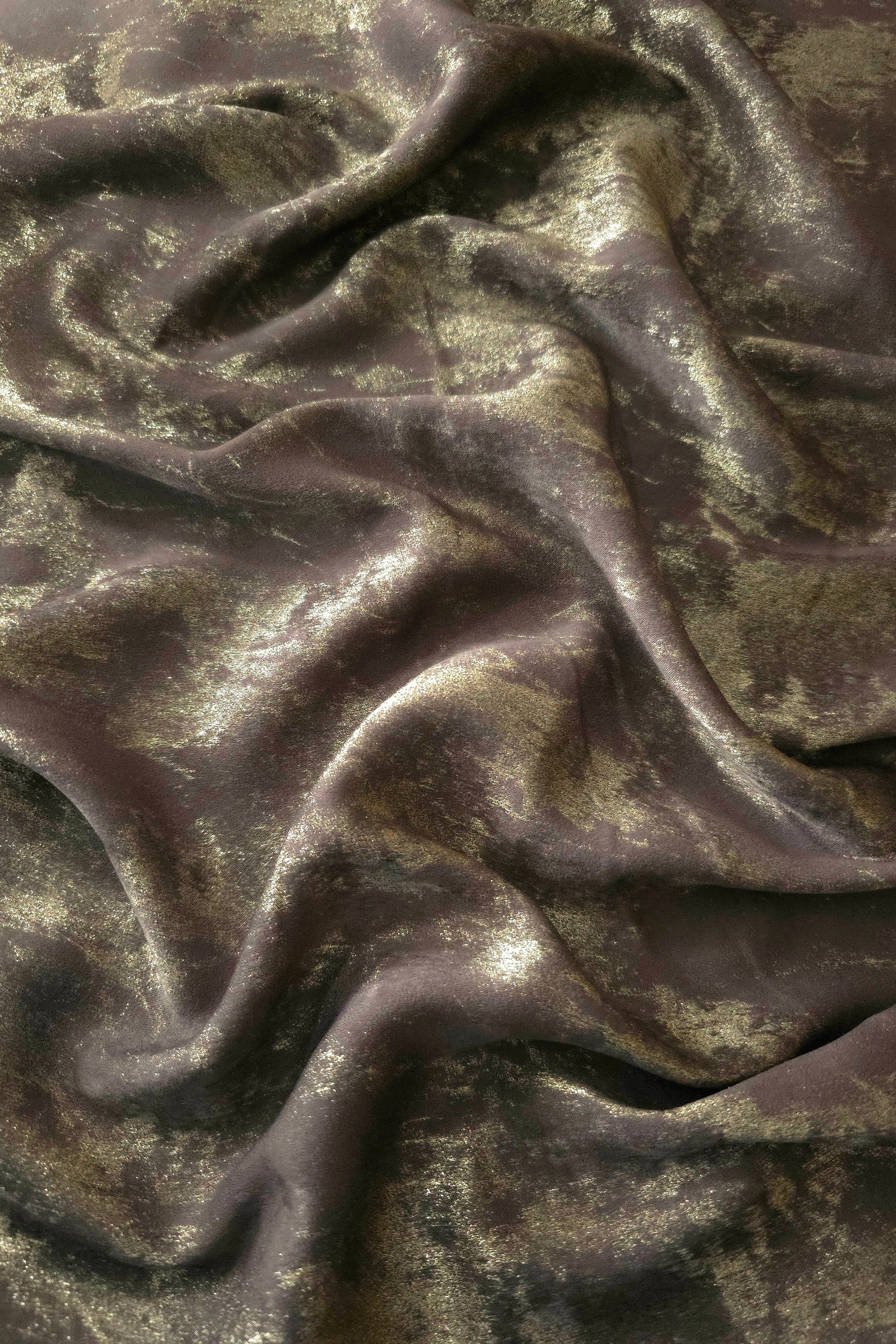 Flowing folds of Olive Bronze Lurex Italiano fabric highlighting fluid drape for abayas, kaftans and modest dresses.