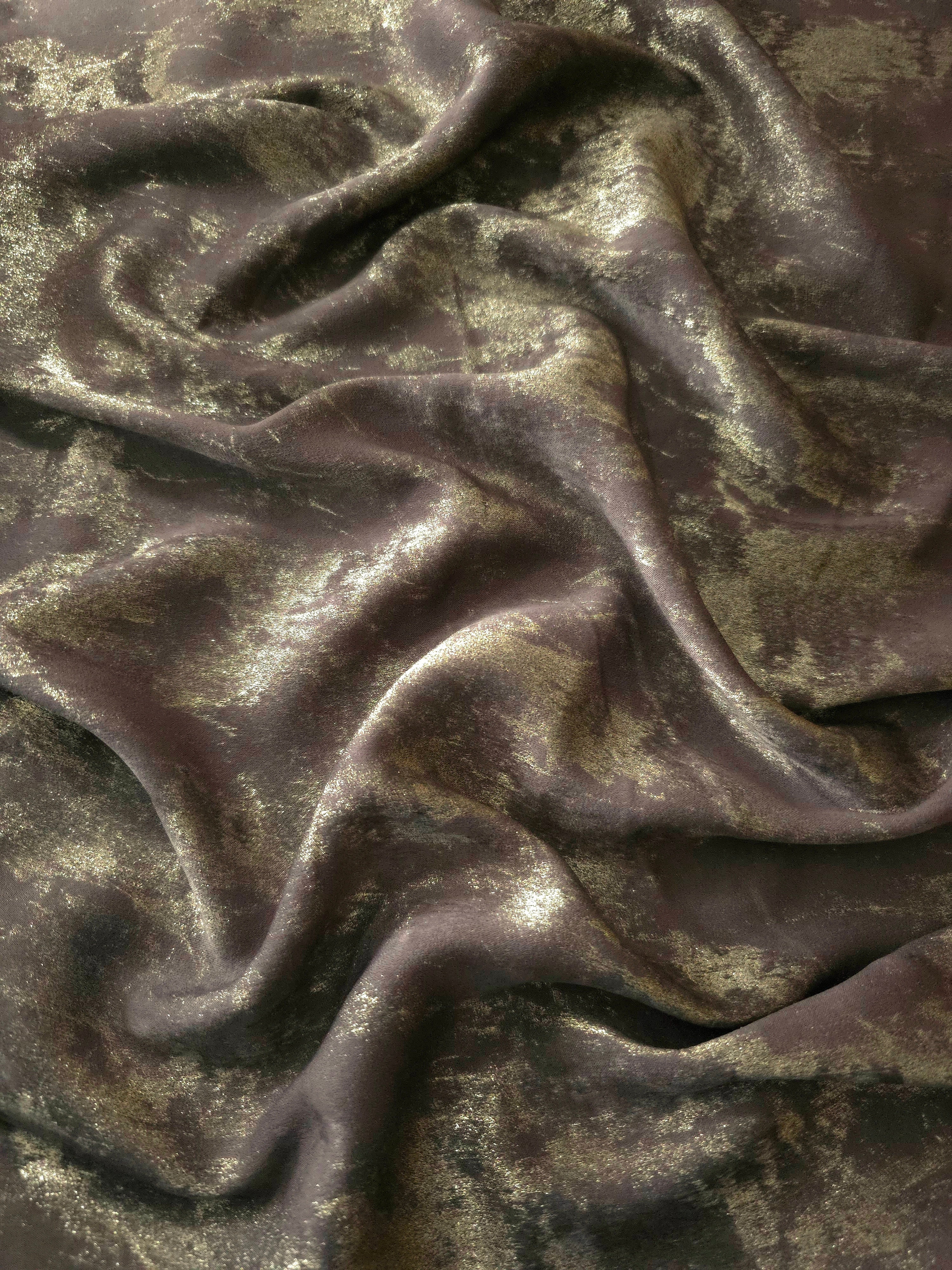 Flowing folds of Olive Bronze Lurex Italiano fabric highlighting fluid drape for abayas, kaftans and modest dresses.