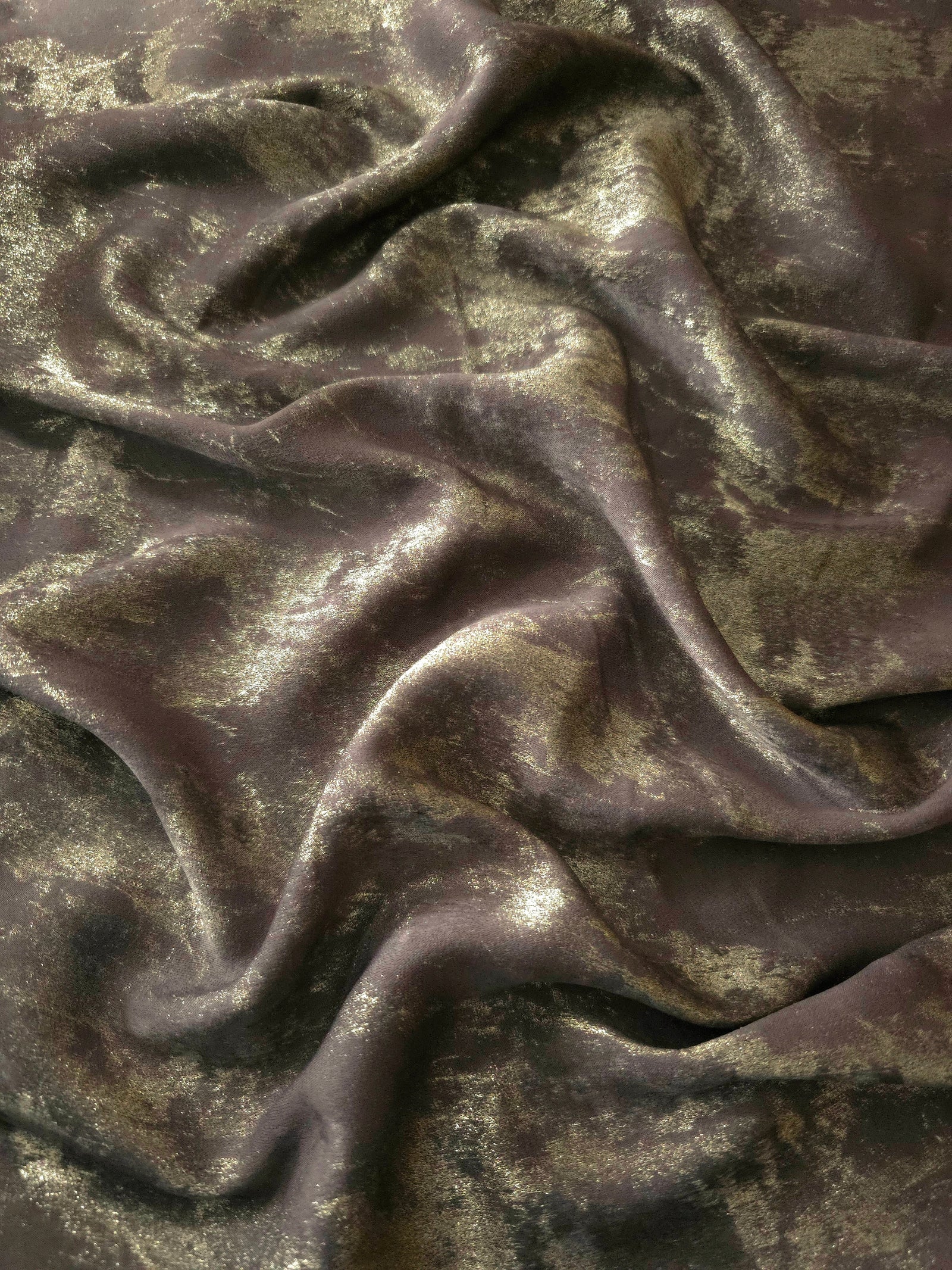 Flowing folds of Olive Bronze Lurex Italiano fabric highlighting fluid drape for abayas, kaftans and modest dresses.