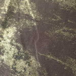 Macro close-up of Olive Bronze Lurex Italiano fabric revealing the gold-toned metallic texture for designer apparel.