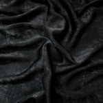Flat view of Onyx Black Lurex Italiano fabric showing its metallic foil surface for luxury apparel.