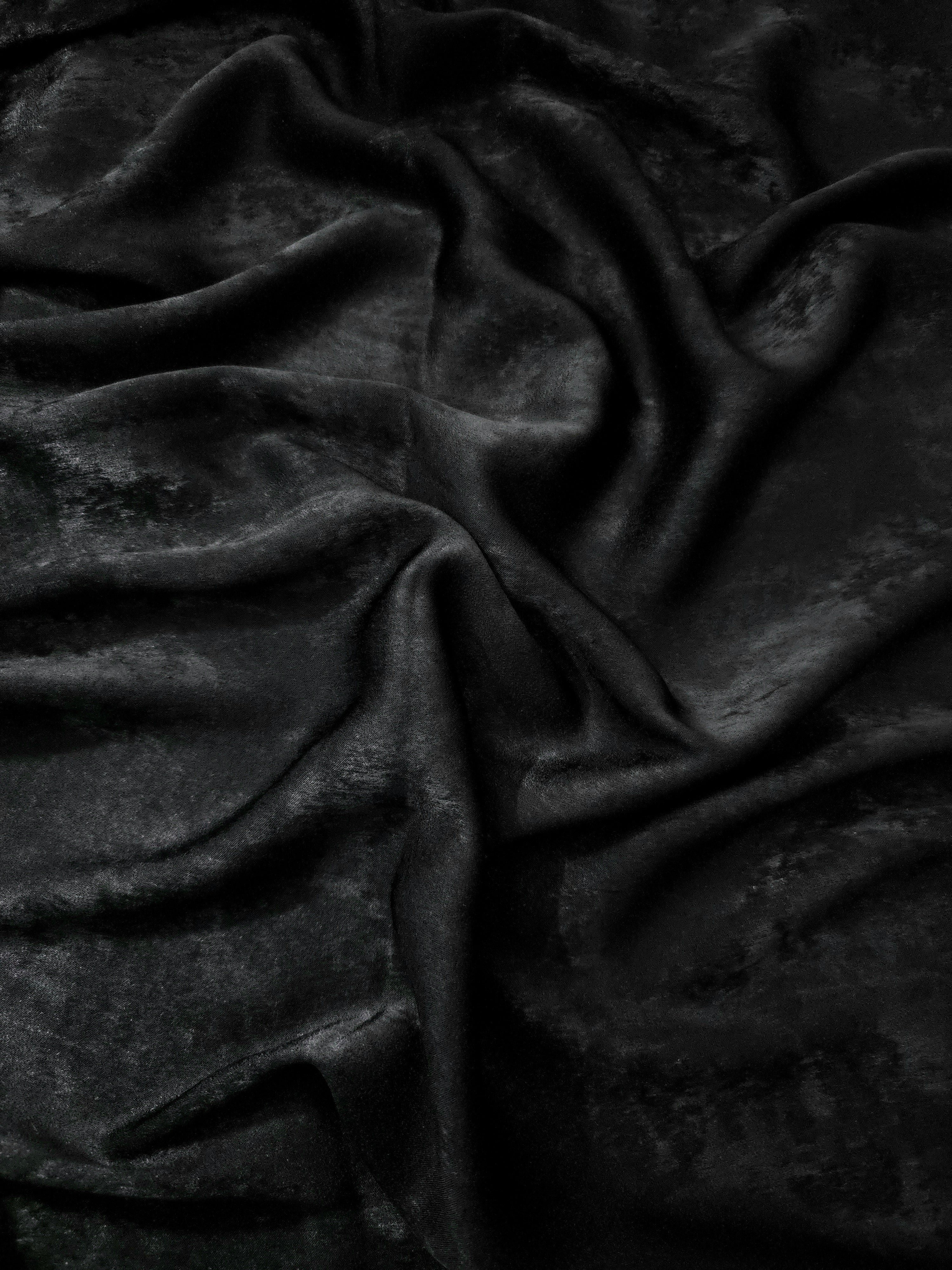 Flat view of Onyx Black Lurex Italiano fabric showing its metallic foil surface for luxury apparel.