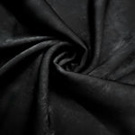 Rosette drape of Onyx Black Lurex Italiano fabric emphasizing shimmer for kaftans and occasionwear.