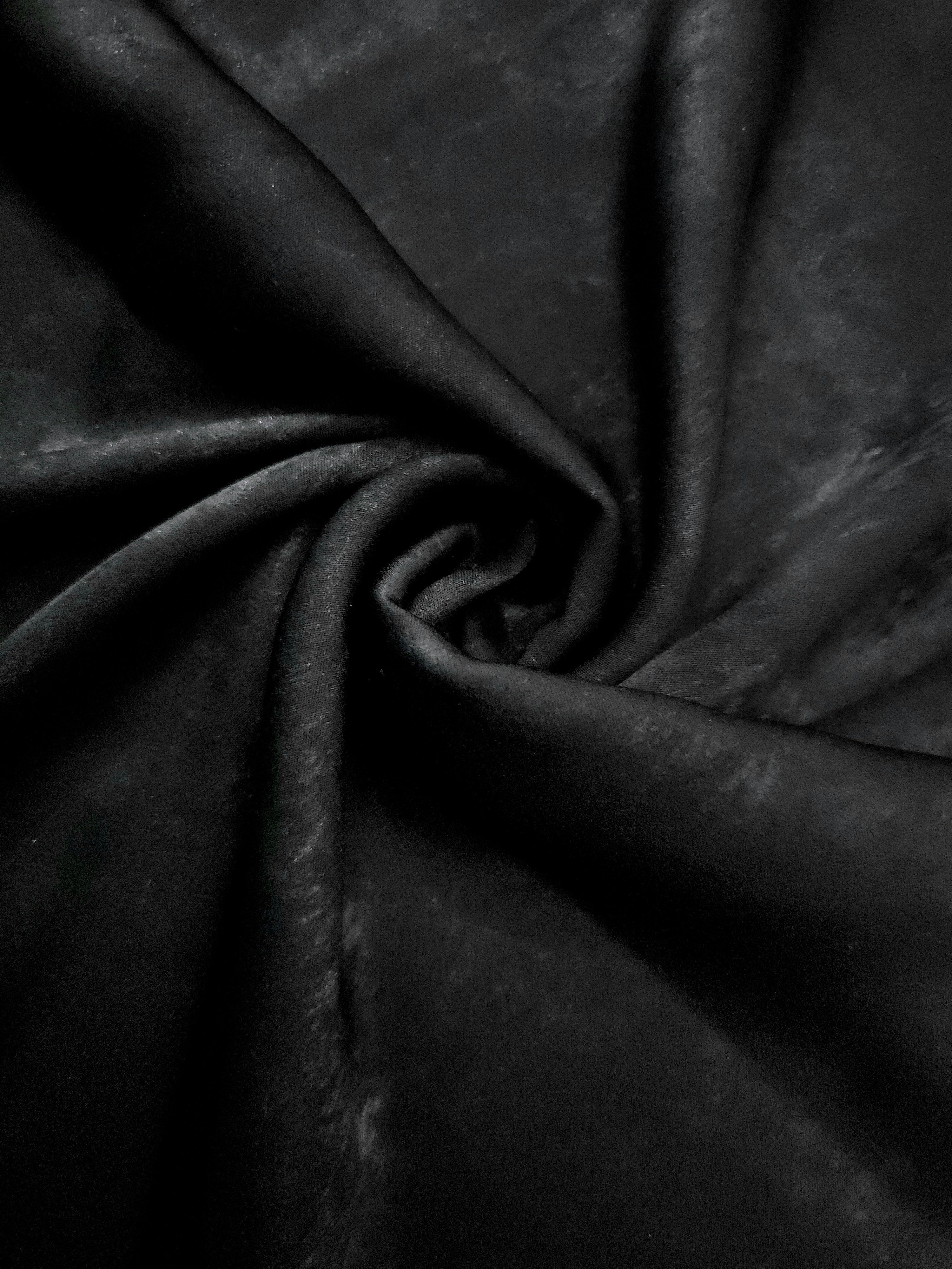 Rosette drape of Onyx Black Lurex Italiano fabric emphasizing shimmer for kaftans and occasionwear.