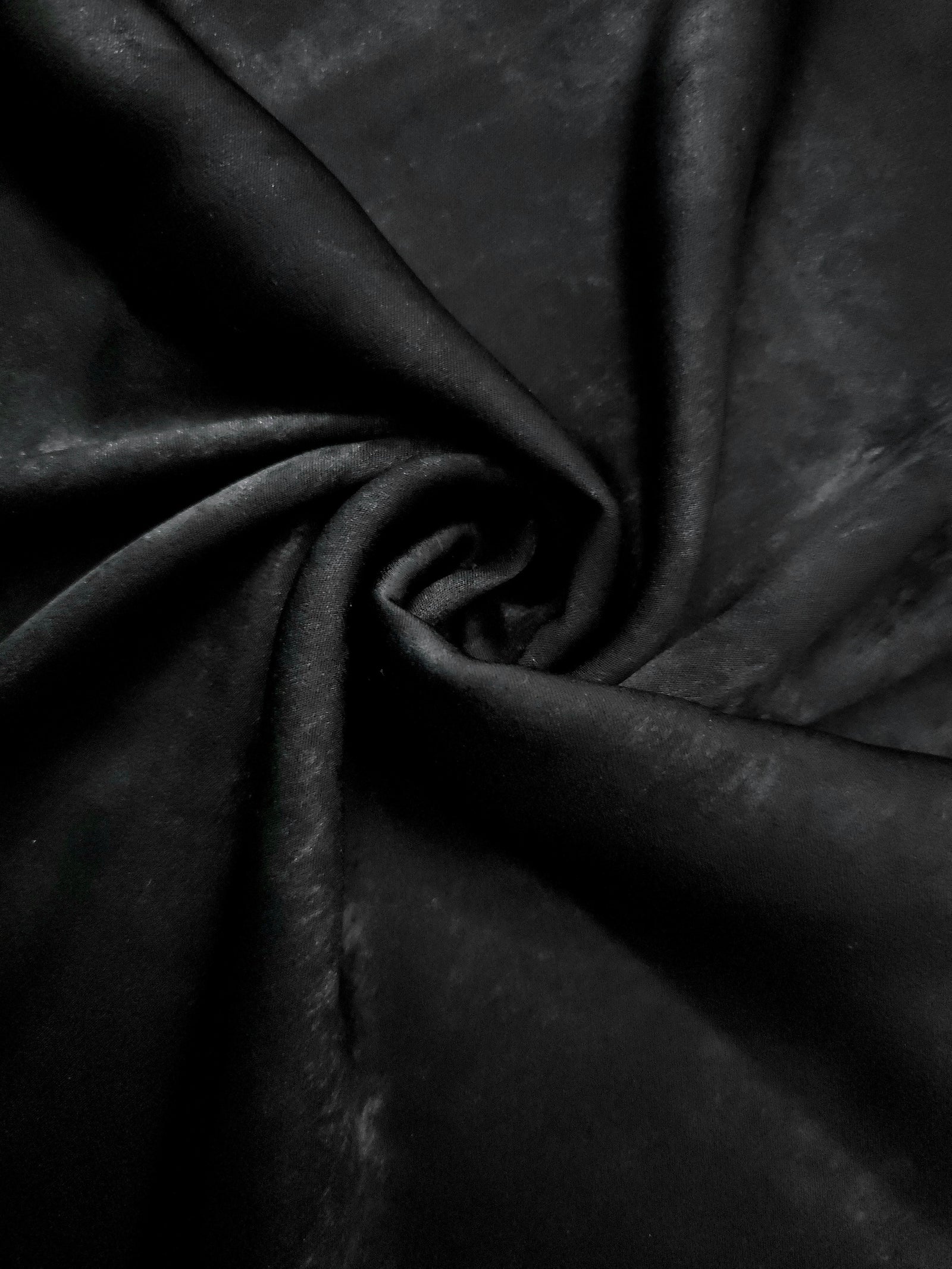 Rosette drape of Onyx Black Lurex Italiano fabric emphasizing shimmer for kaftans and occasionwear.