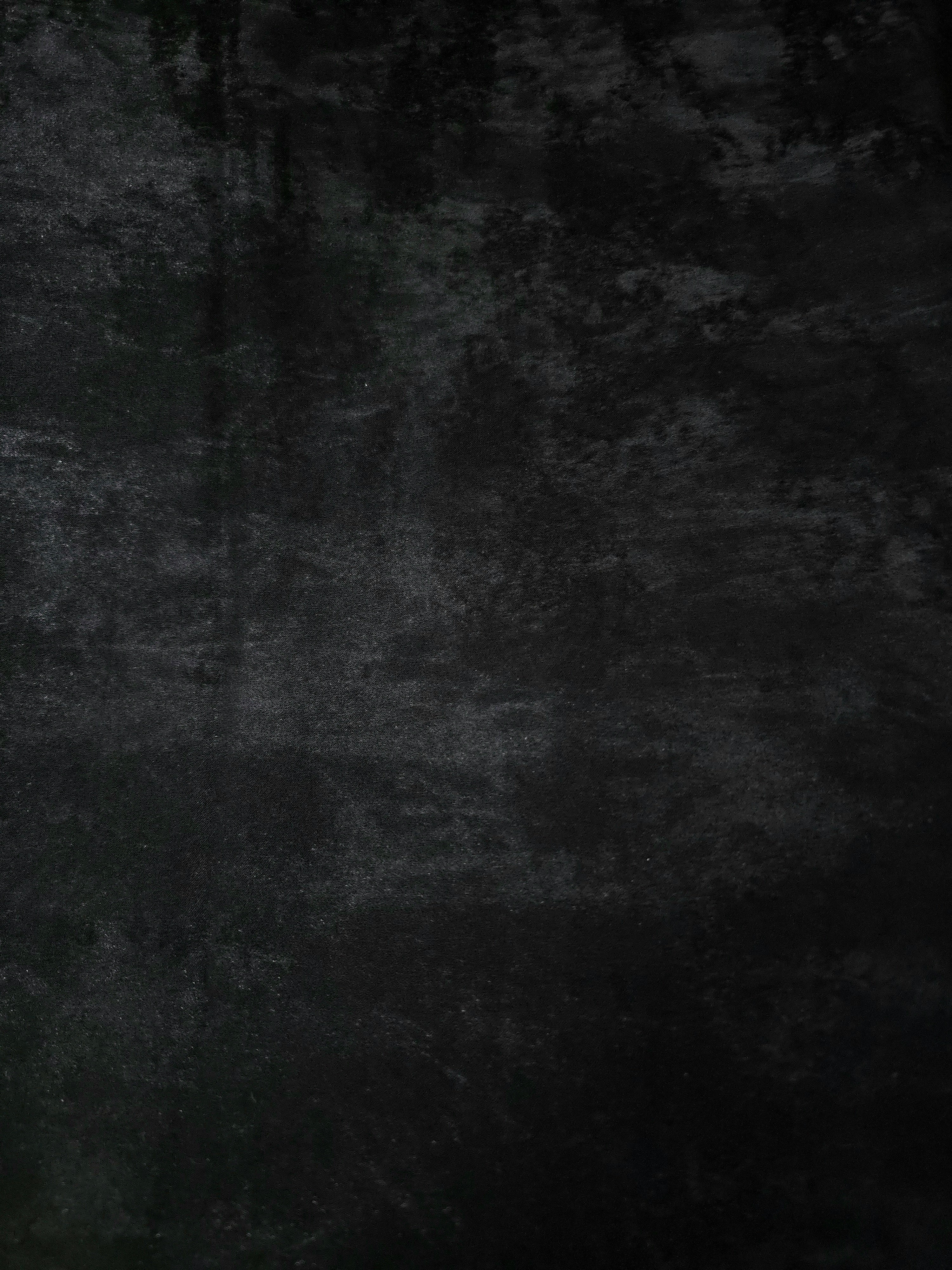Reverse side of Onyx Black Lurex Italiano fabric showing the backing and metallic finish for garment production.