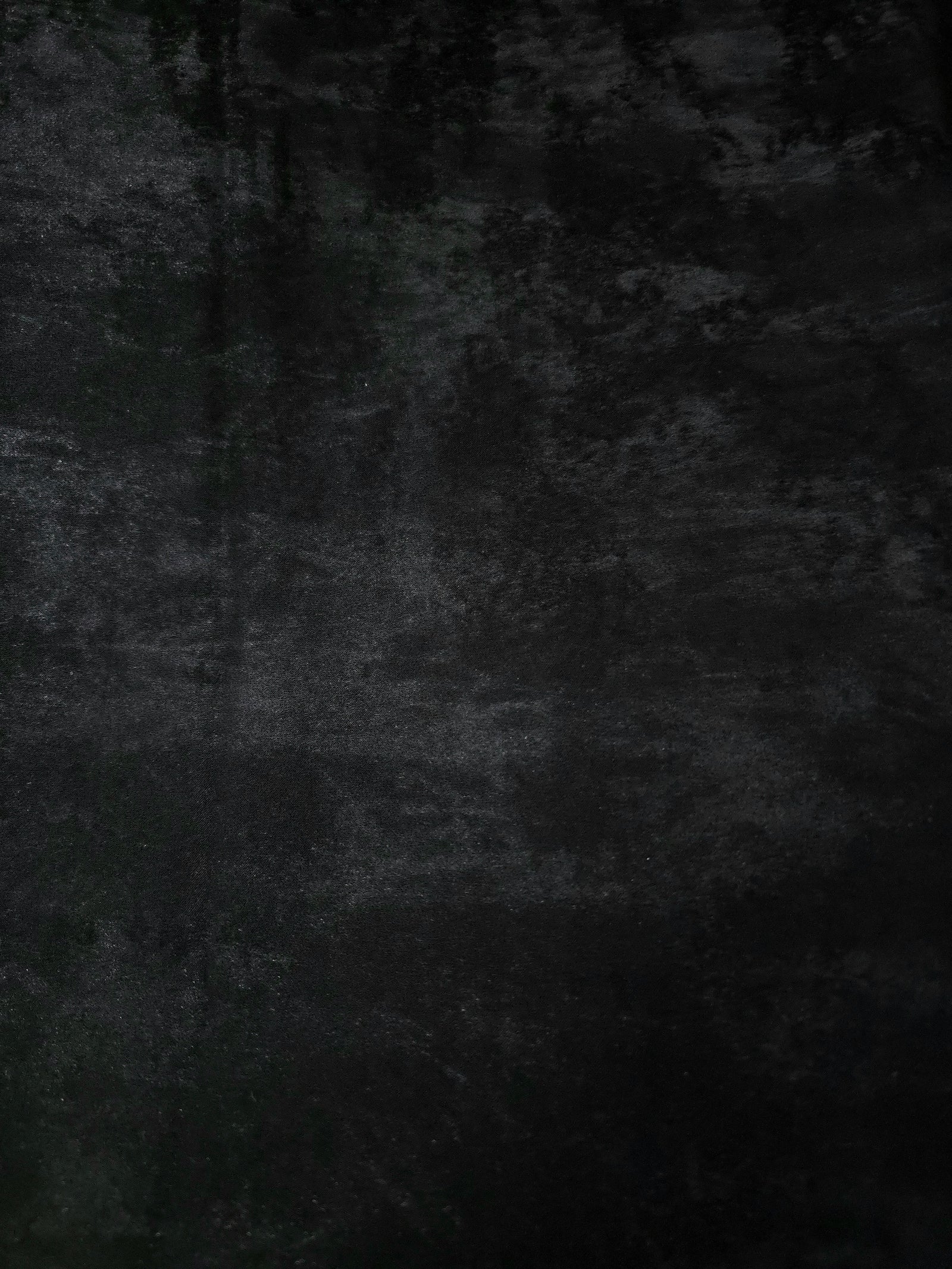 Reverse side of Onyx Black Lurex Italiano fabric showing the backing and metallic finish for garment production.