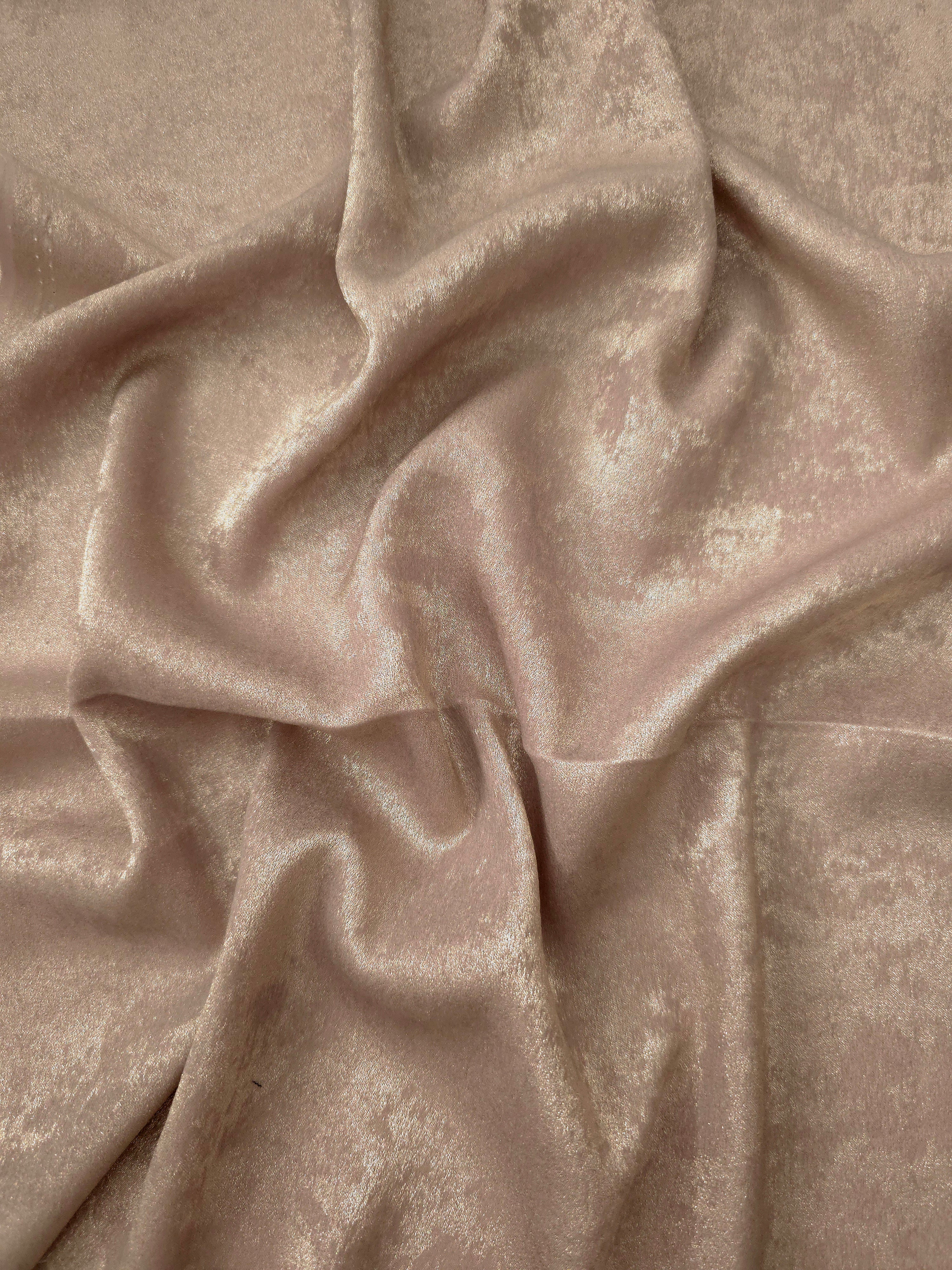 Pearl Beige Lurex Italiano metallic fabric in a rosette drape with luminous shimmer