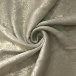 Flowing folds of Pearl Silver Lurex Italiano fabric highlighting drape for abayas, kaftans and dresses.