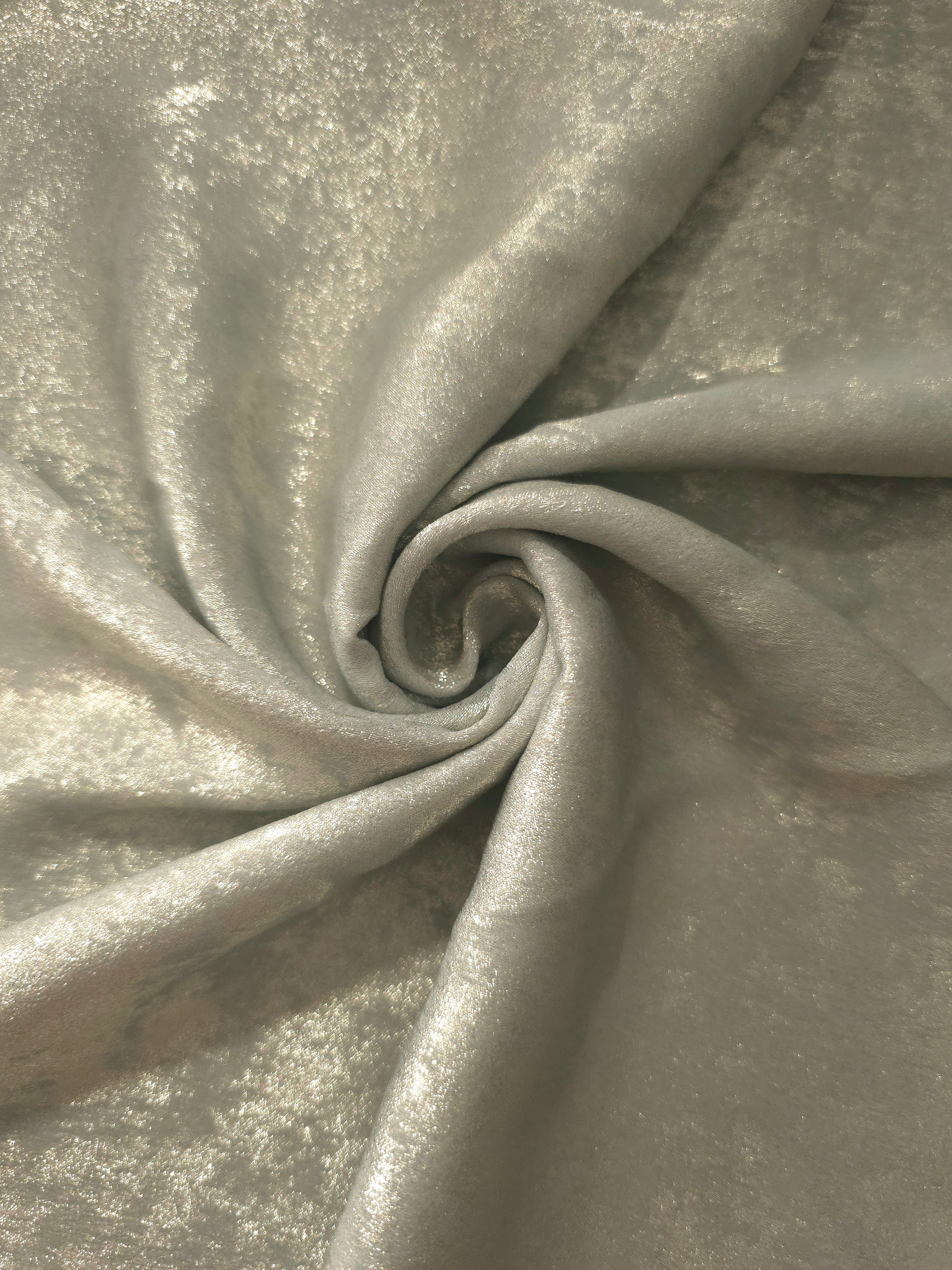 Flowing folds of Pearl Silver Lurex Italiano fabric highlighting drape for abayas, kaftans and dresses.