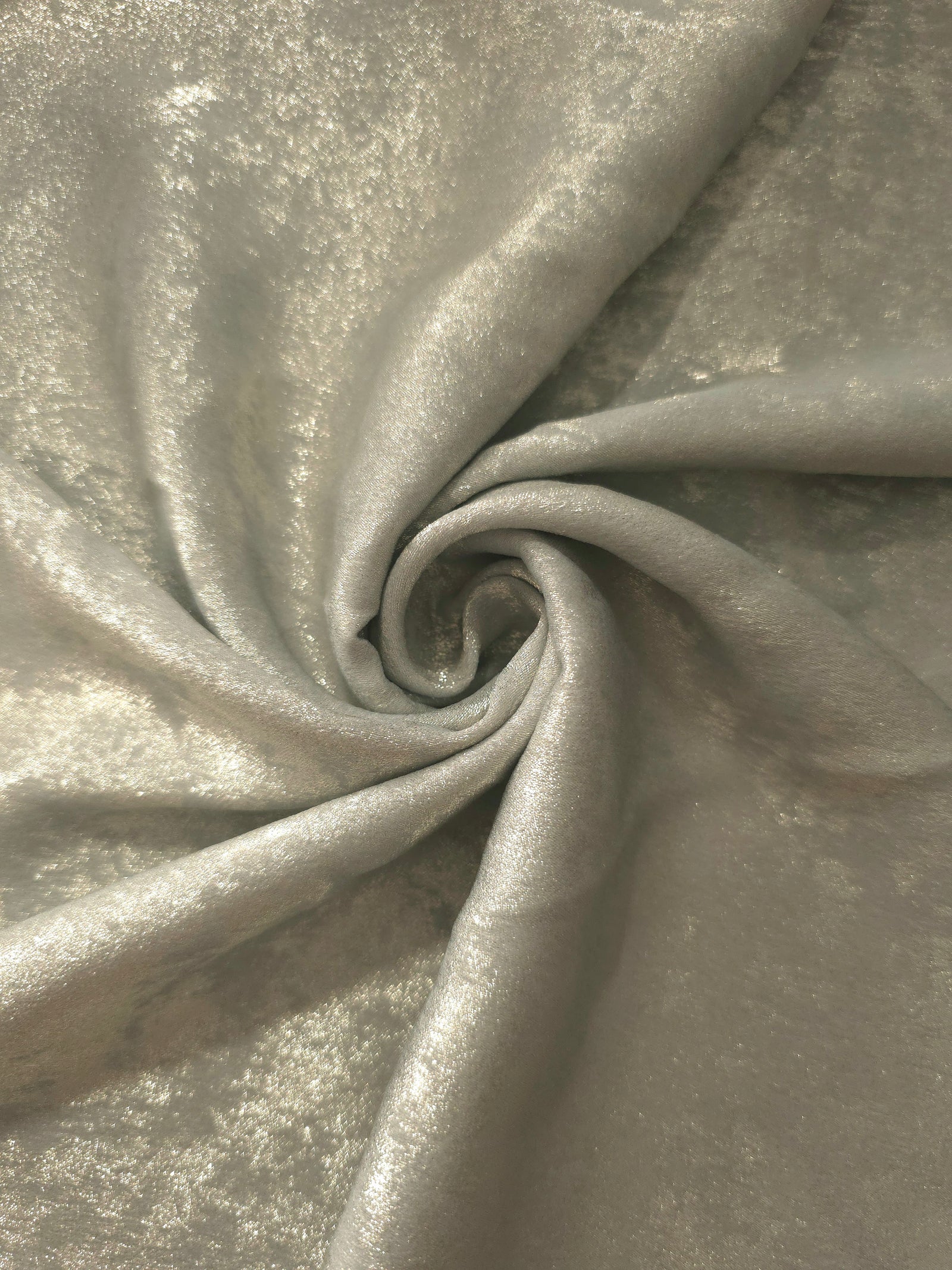 Flowing folds of Pearl Silver Lurex Italiano fabric highlighting drape for abayas, kaftans and dresses.