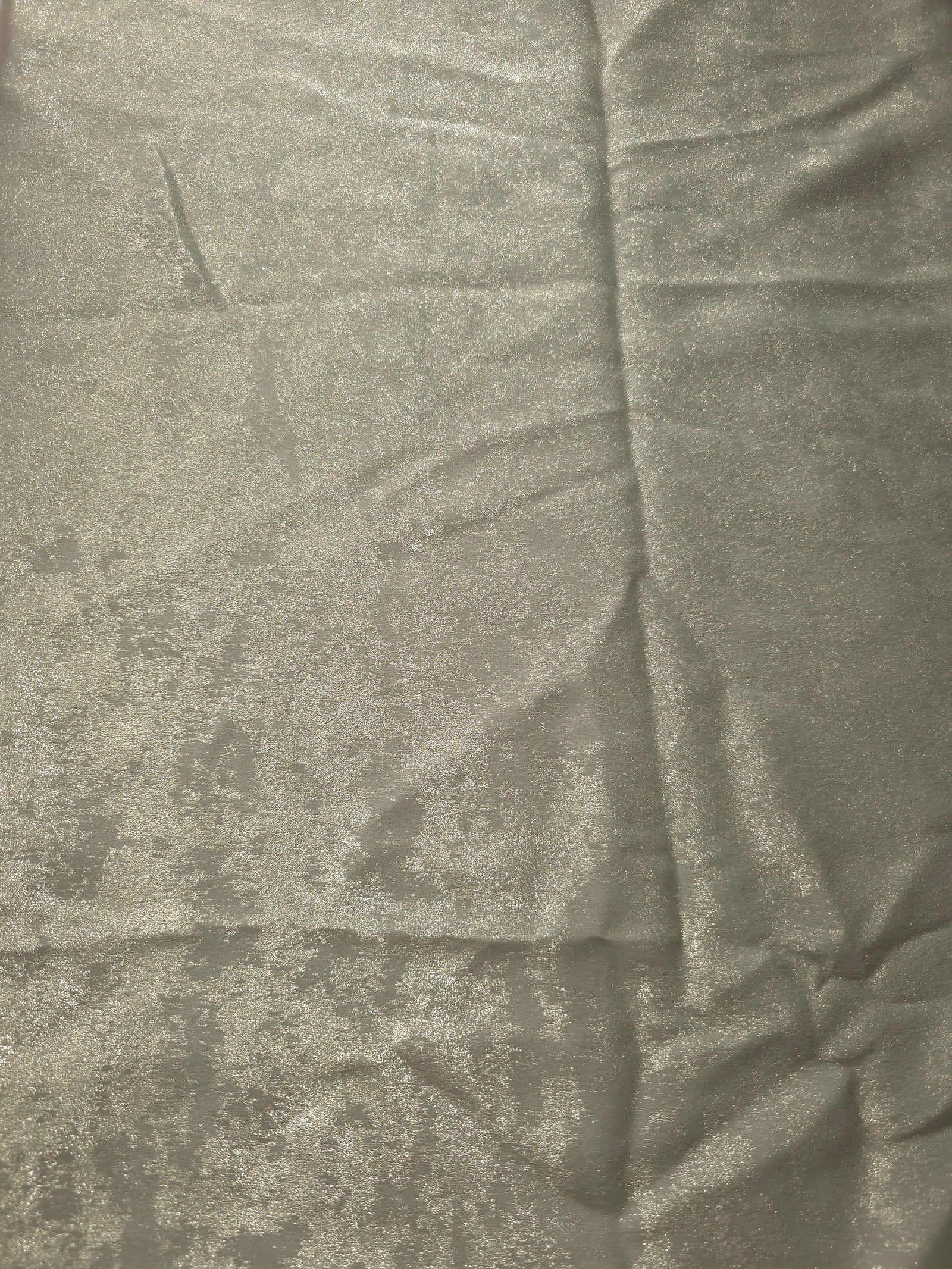 Flat view of Pearl Silver Lurex Italiano fabric showing its metallic foil surface for luxury apparel.