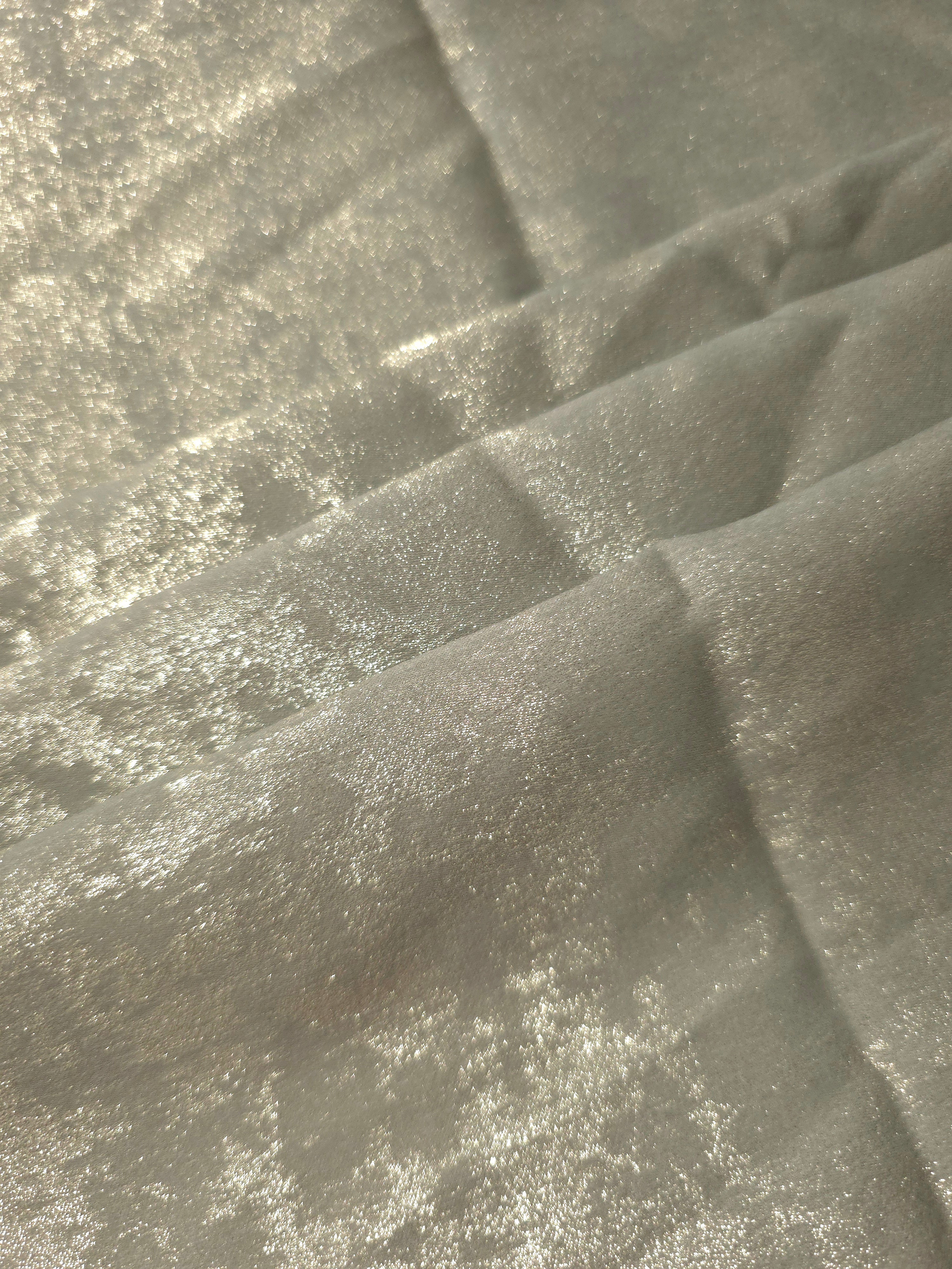 Rosette drape of Pearl Silver Lurex Italiano fabric emphasizing shimmer for kaftans and occasionwear.